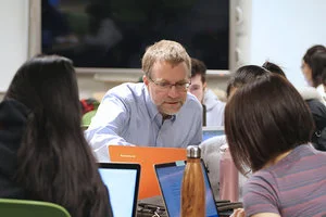 Paul Gries, associate professor, teaching stream, answers student questions during a mastery-based section of Introduction to Computer Programming (photo by Ryan Perez)