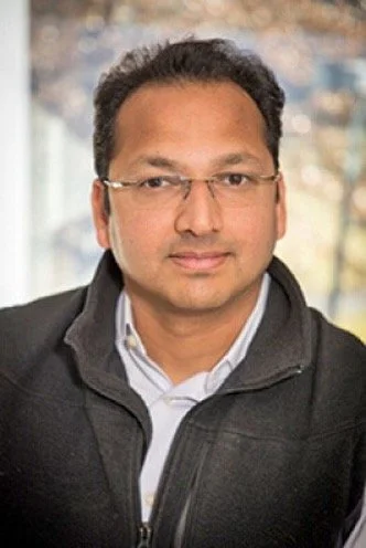 Vijay Janapa Reddi smiling and facing the camera.