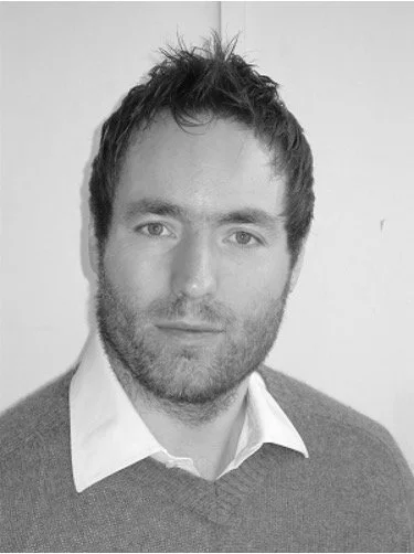 Peter Marbach smiles facing the camera.