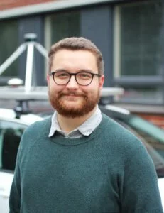 Risto Ojala smiles facing the camera.