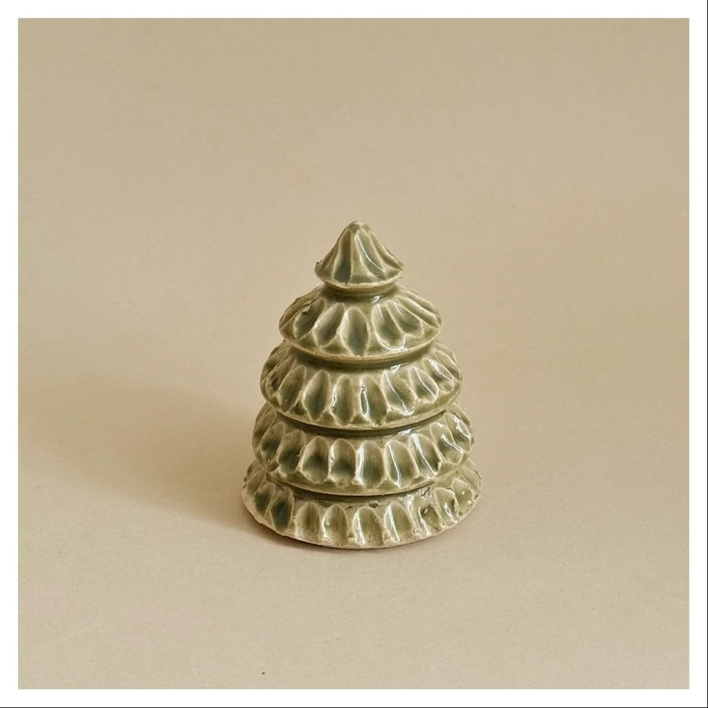 Little tree + little house on display at home and in the shop. Personally love collecting these each year for the window seal :) Handmade and one of a kind!