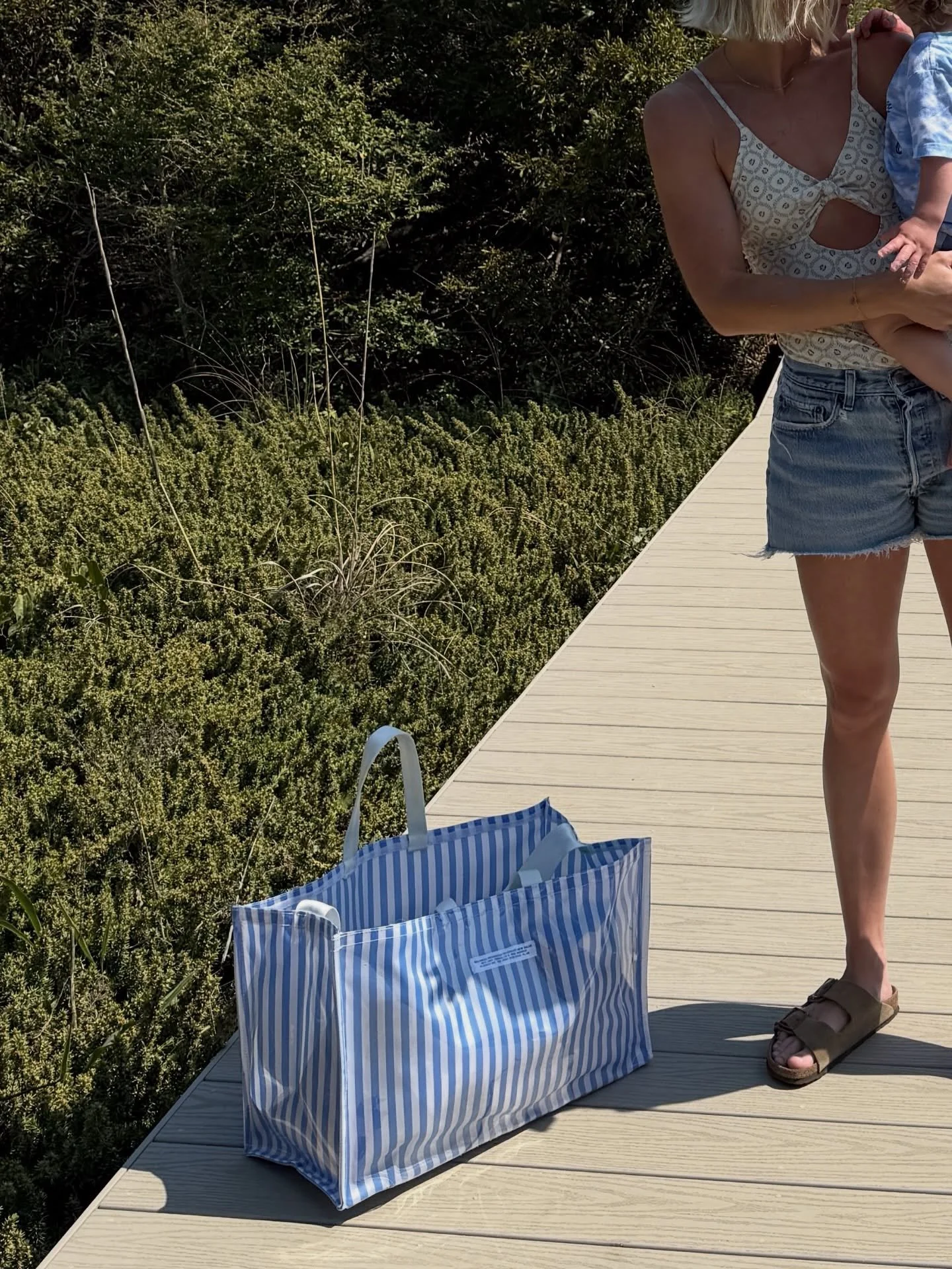 the perfect beach, pool, travel bag. holds all the things (even the wet ones) and has the most sturdy yet broken in shoulder strap perfect for hands free moments this Summer. slide to see a personal favorite combo the pink + green stripe!