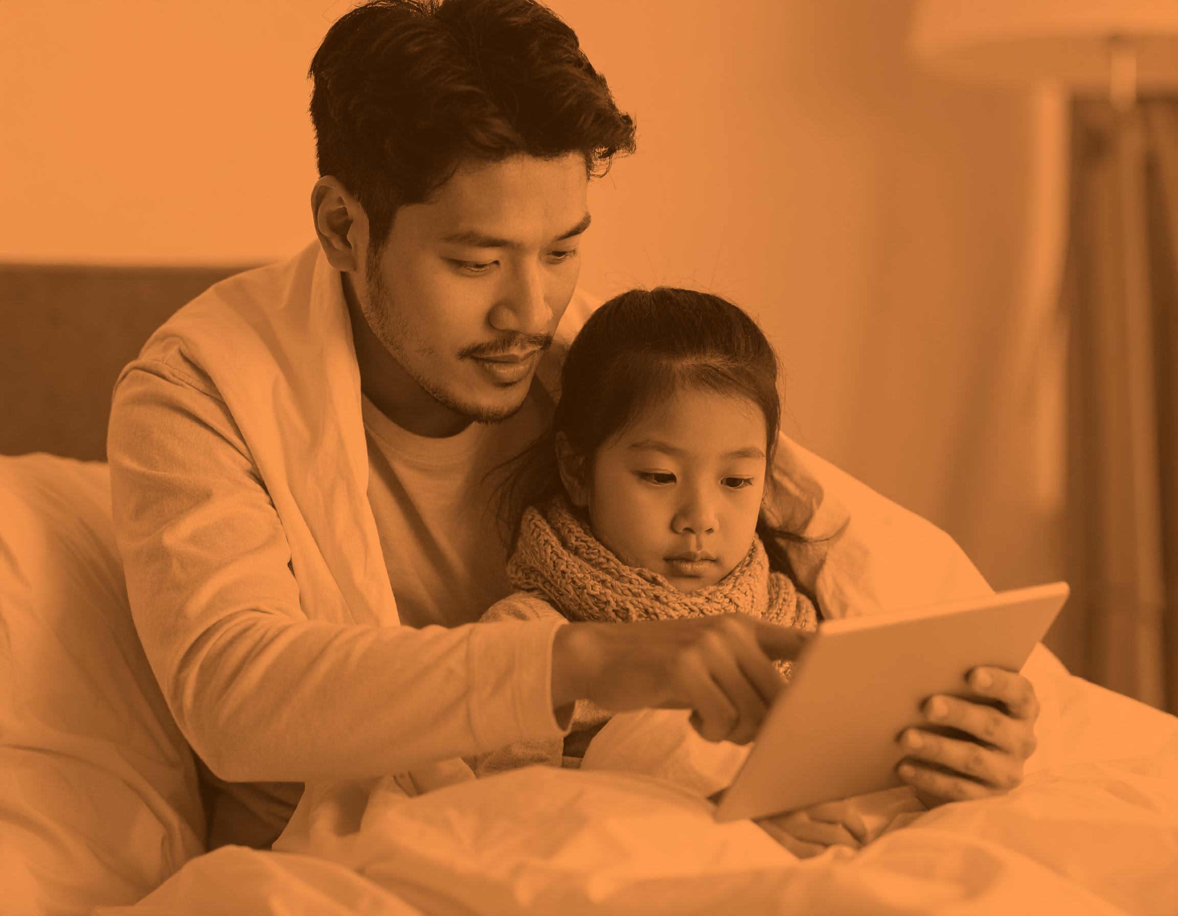 Father helping daughter with iPad.png