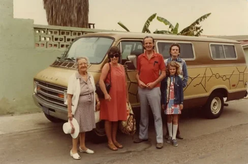 The Feynman family next to Feynman’s famous van that holds drawings explaining his QED theory called the Feynman diagrams.