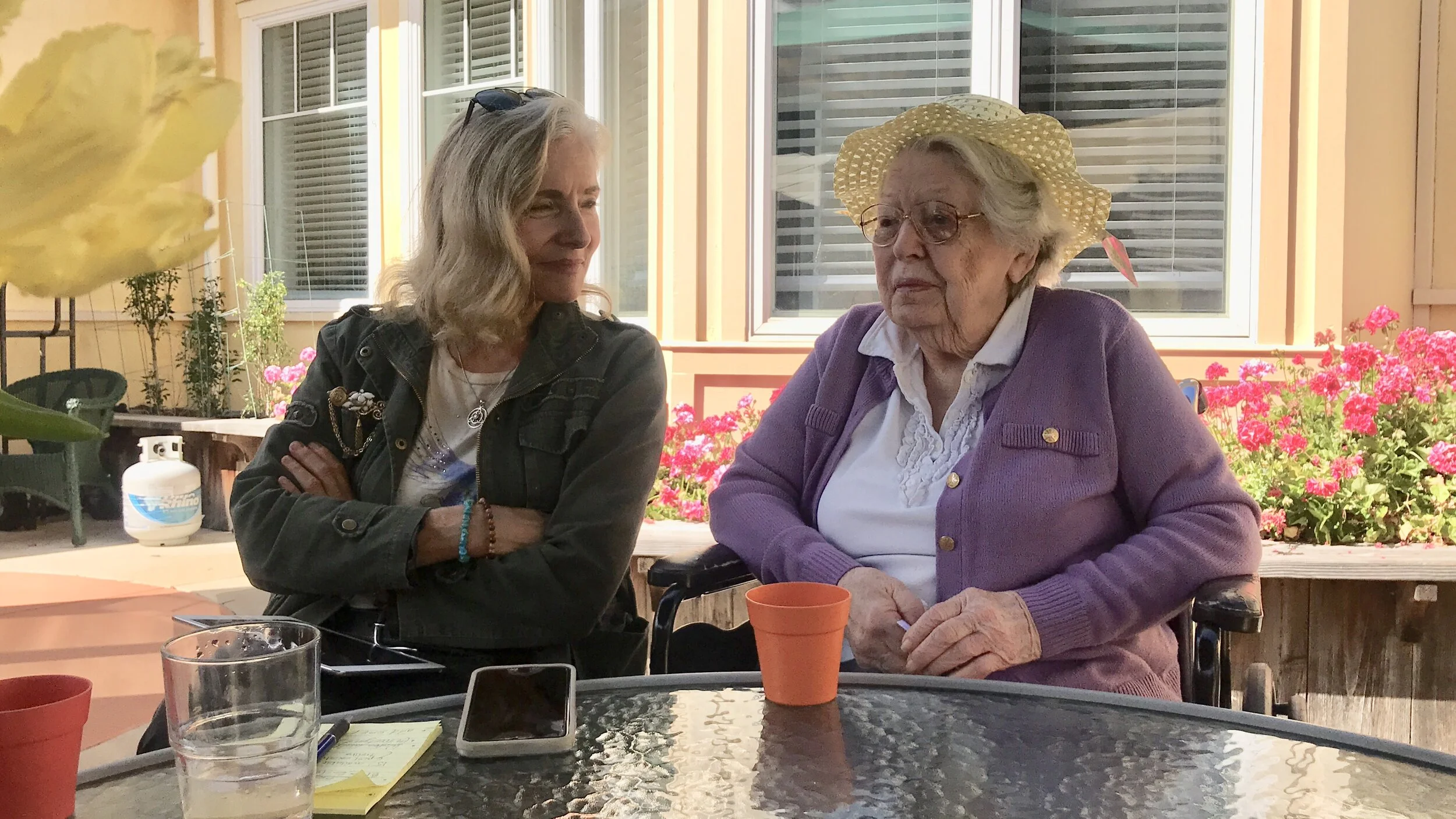 Impromptu discussion with our landscape designer about which plants would do best in the patio planters.