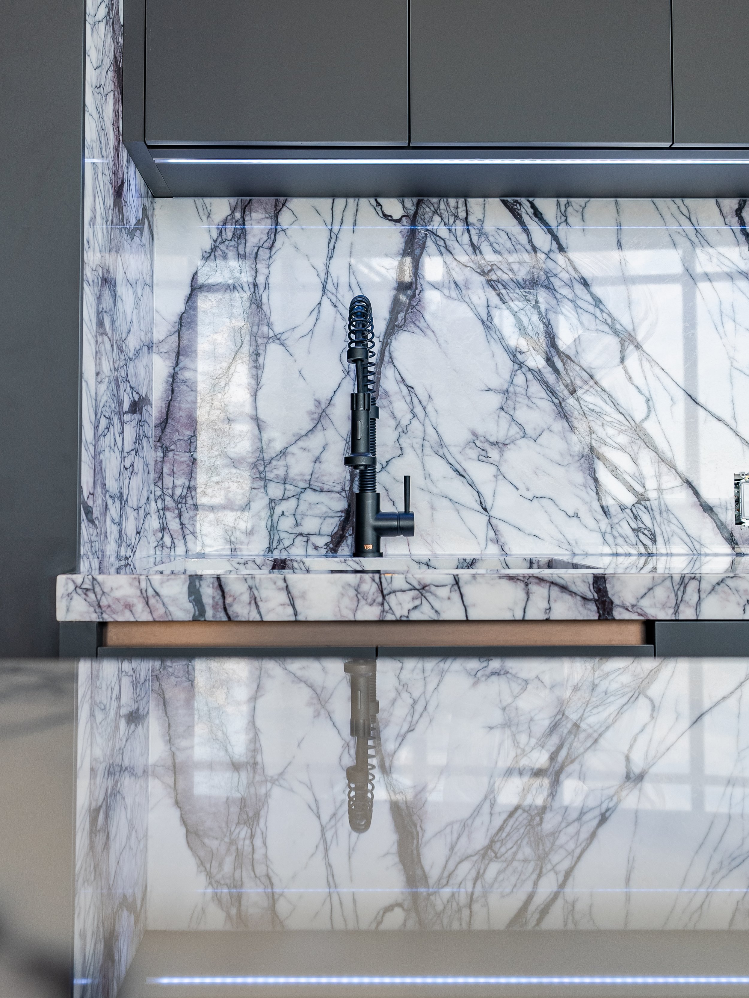  All marble in this Etobicoke Penthouse Condo now protected with polished PROSHIELD. Polished Lilac Marble Kitchen as well as Sahara Noir Marble side bar &amp; wall within the home. 