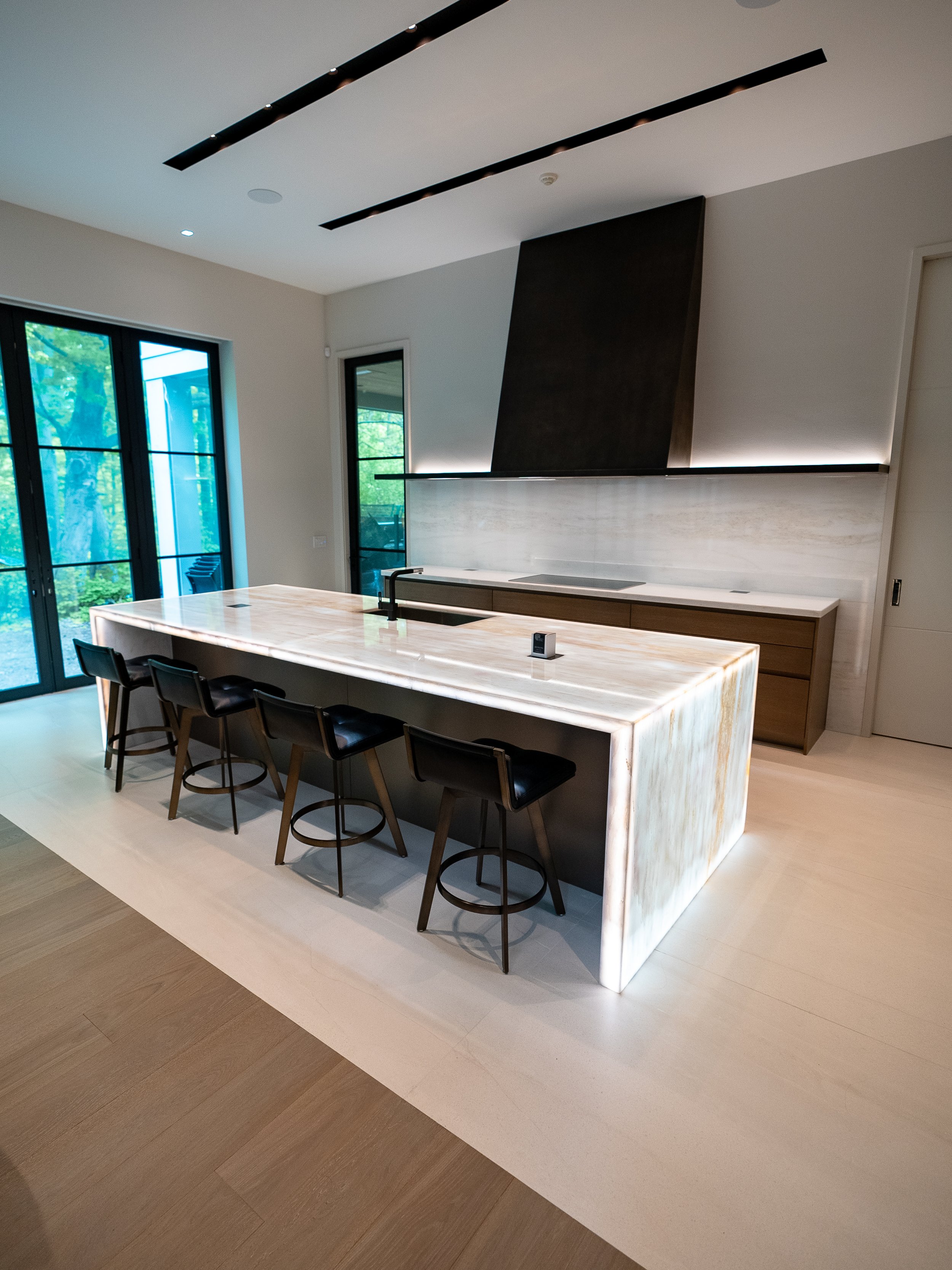  Several natural stone surfaces preserved with both polished &amp; honed PROSHIELD in this Bridle Path, Toronto home. Backlit Cristallo Quartzite kitchen island, range &amp; countertops, basement bar island, countertops as well as wine bar. Polished 