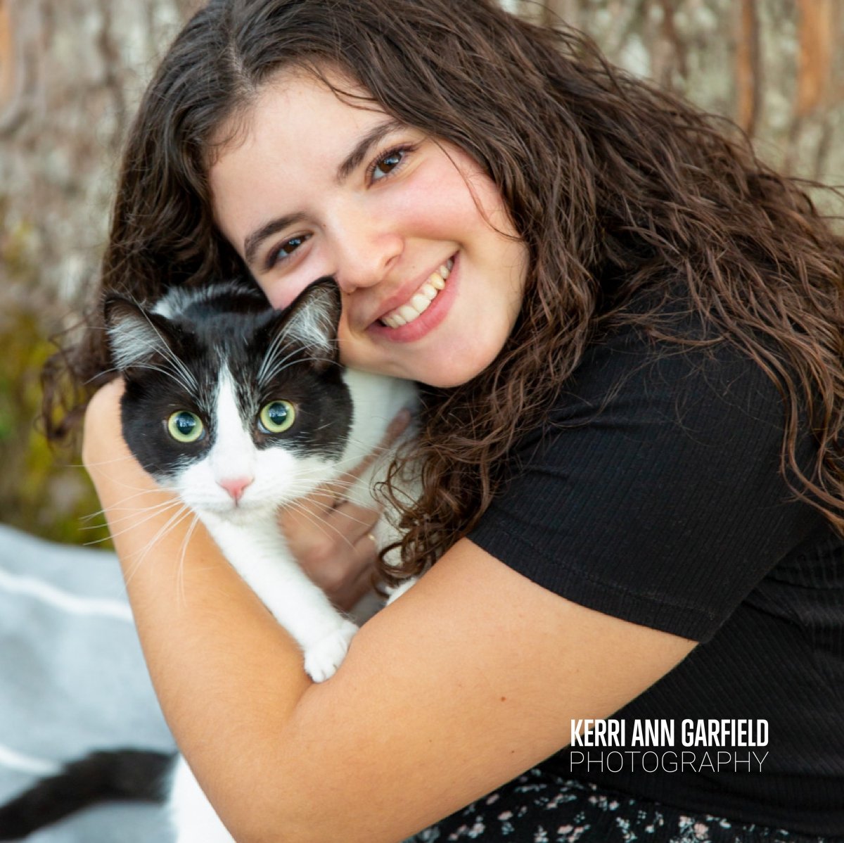 It's not uncommon to have a senior bring their family dog for their Senior Photos, but this time we got to photograph with Emma's kitty, Joel! How adorable is he? Pets can bring out such beautiful smiles in people; you can see how much Emma loves him