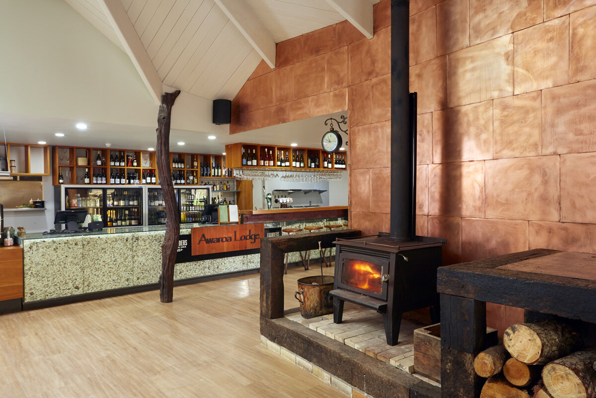 Awaroa Lodge Main Bar and Fireplace.jpg