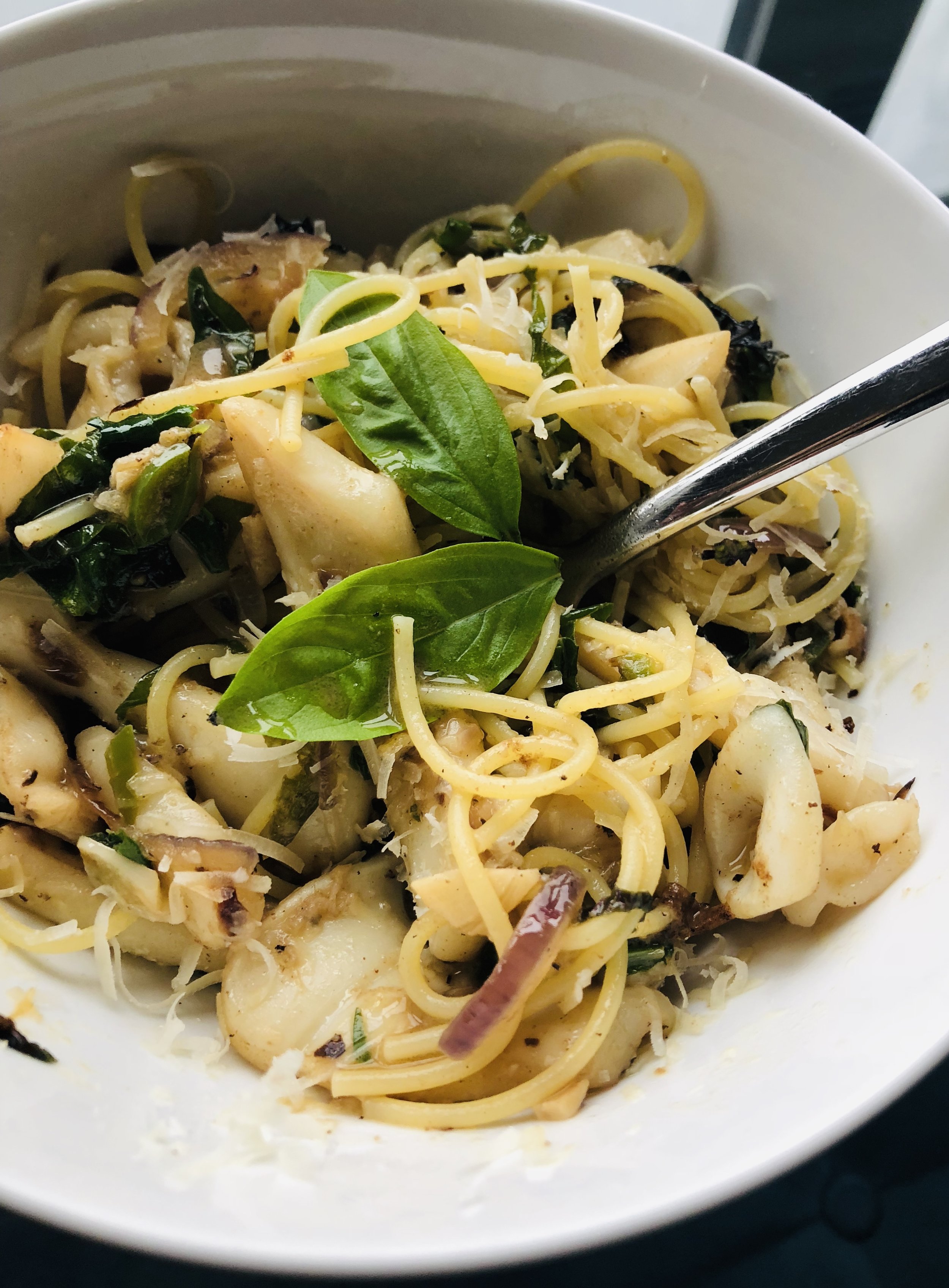 Spaghetti with slivered red onion, jalapeno, basil and fresh squid