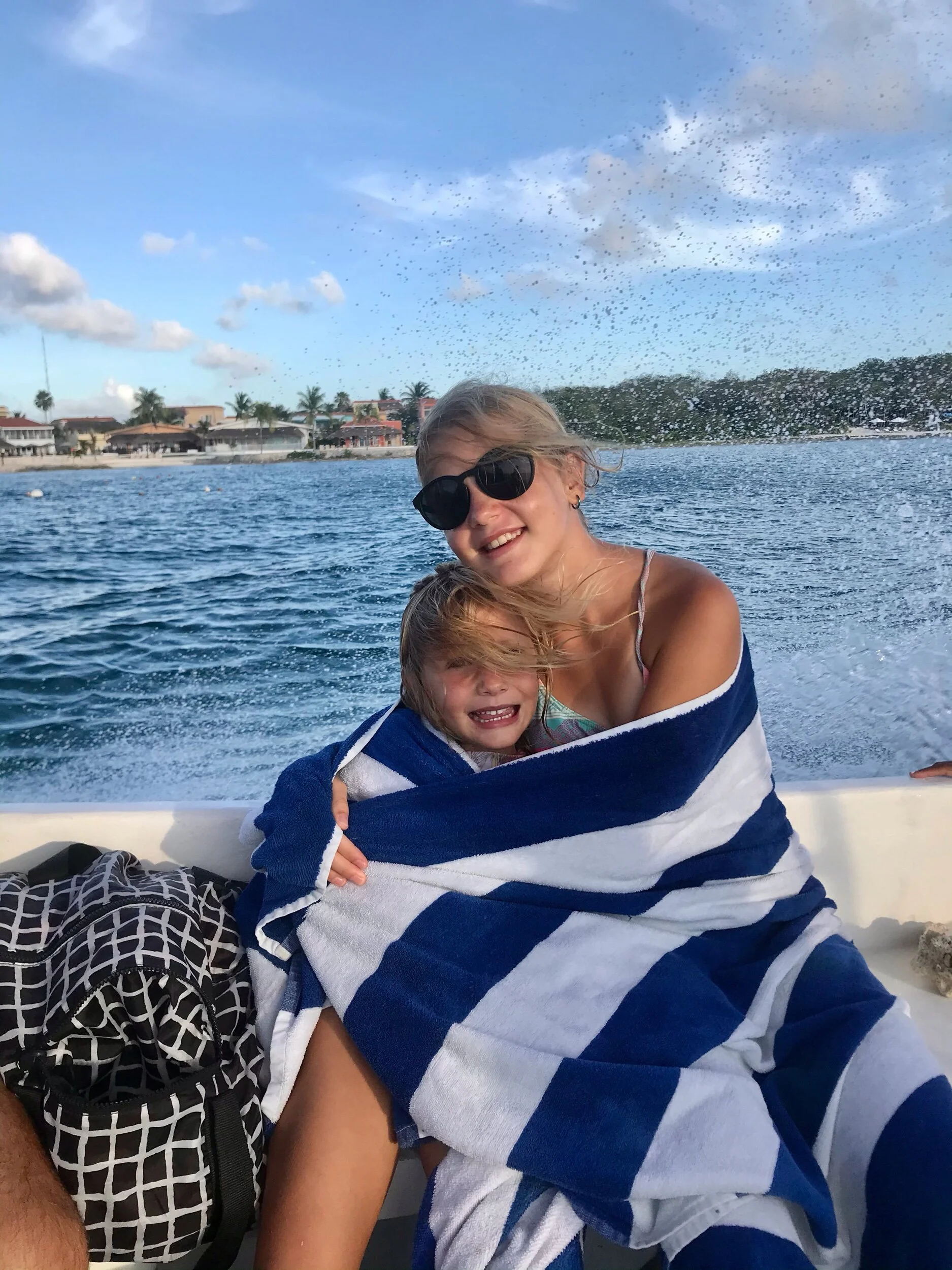 Madie and I huddling together after coming out of the water. Brr!!