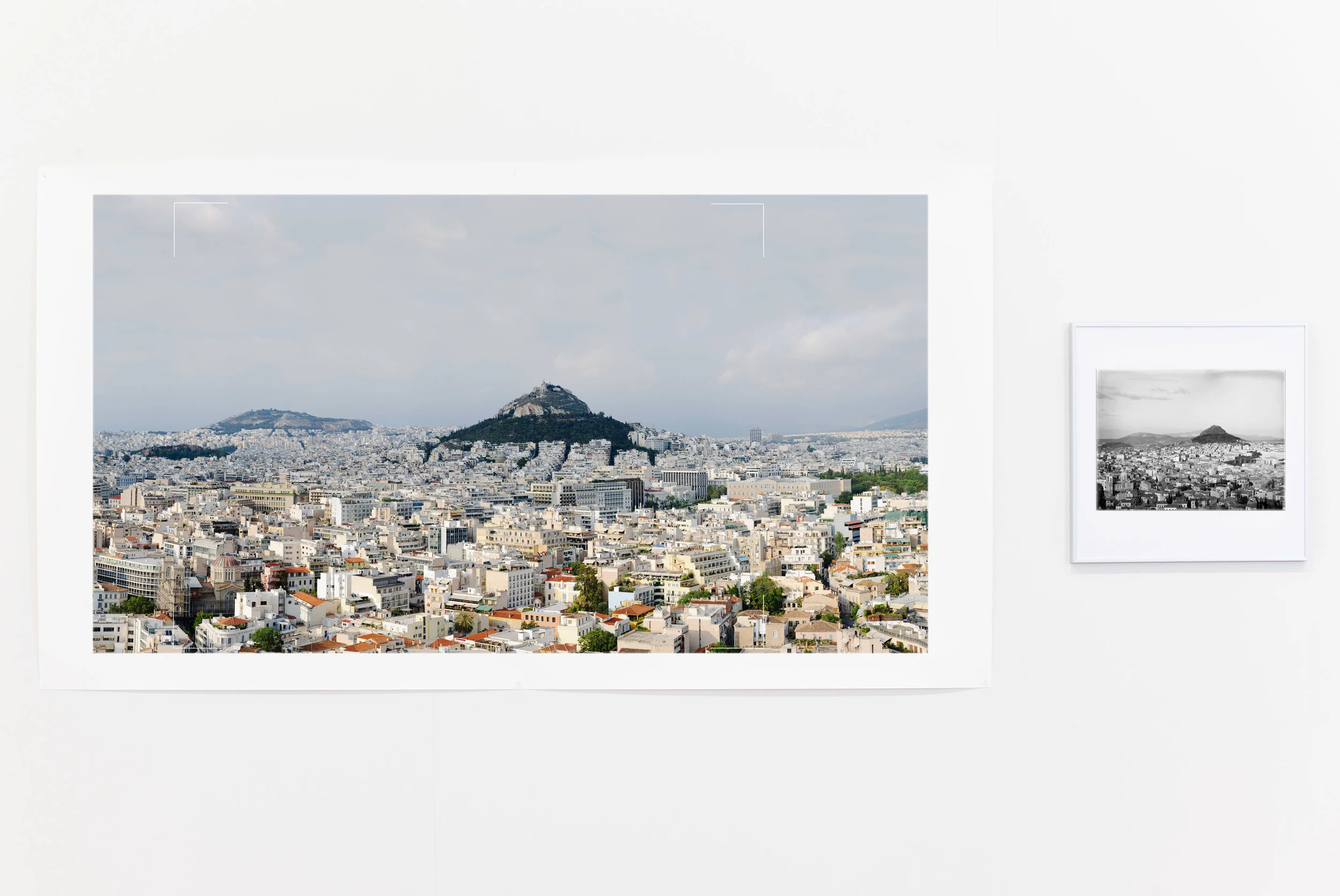L - Rowan Conroy, View of central Athens from the Acropolis. 5:46 pm, 5 June 2010, 7˚58”19 N 23˚43’39” E , pigment inkjet print on cotton rag paper. This work was shortlisted in the Bowness Photography Prize 2012. R - William John Woodhouse, NM2007.55.7, View of Central Athens and Lycabettus, looking north, c.1908. Carbon Piezo print on cotton rag, reprinted 2011 from scan of original glass plate negative. Copyright Nicholson Museum, The University of Sydney.