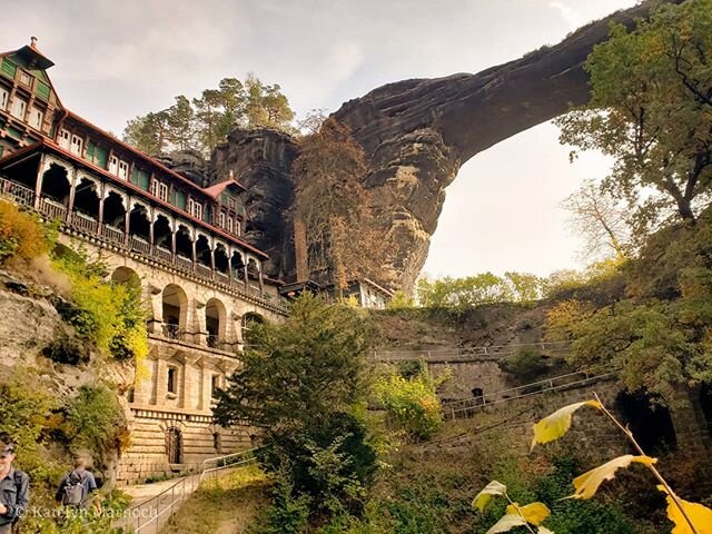 Pravčick&aacute; br&aacute;na - Bohemian Switzerland National Park, Czech Republic 
This beautiful sandstone arch is the largest natural archway in Europe and features a former hotel, the Falcon's Nest, built directly into the side of the stone in 18
