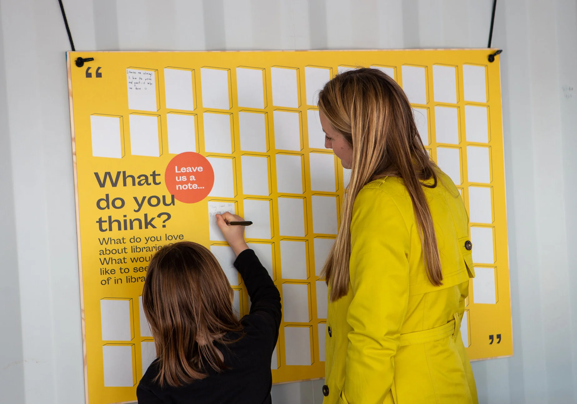 Messages begin to appear on the note board, set up as part of the We Love Libraries exhibition.