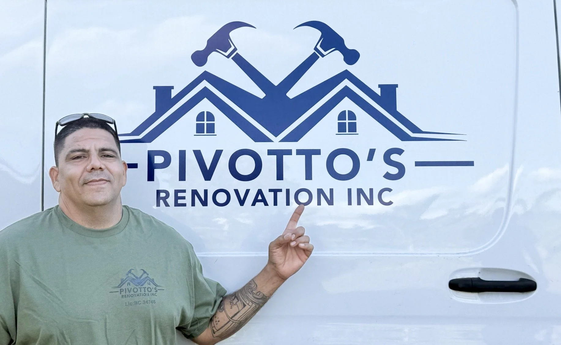 A man standing in front of a van with a logo that reads 'Pivotto's Renovation Inc' and displays two crossed hammers and house rooftops. The man is pointing at the logo.
