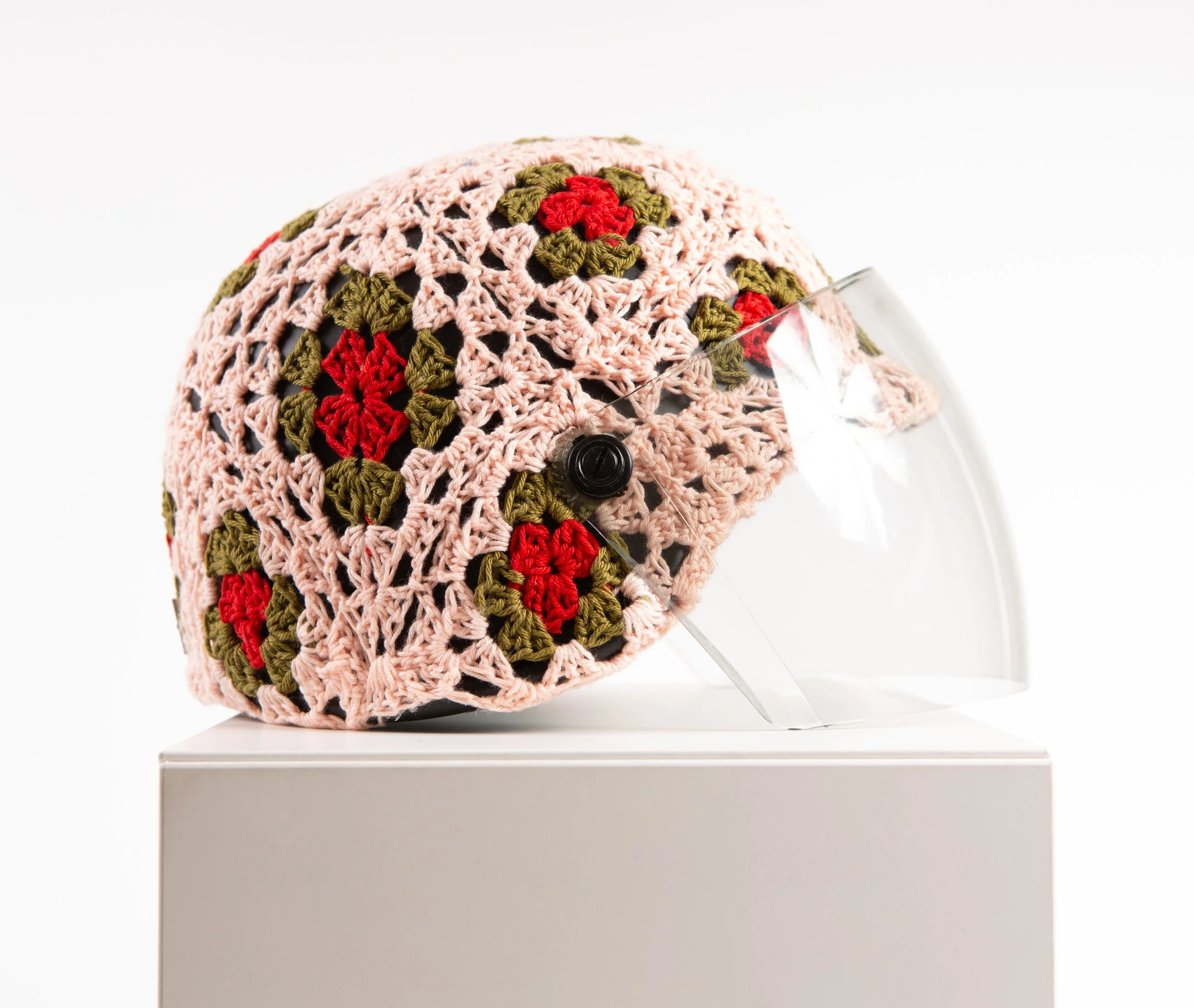 Pink helmet hand-crocheted textile sculpture by Paris artist Sophie Inard