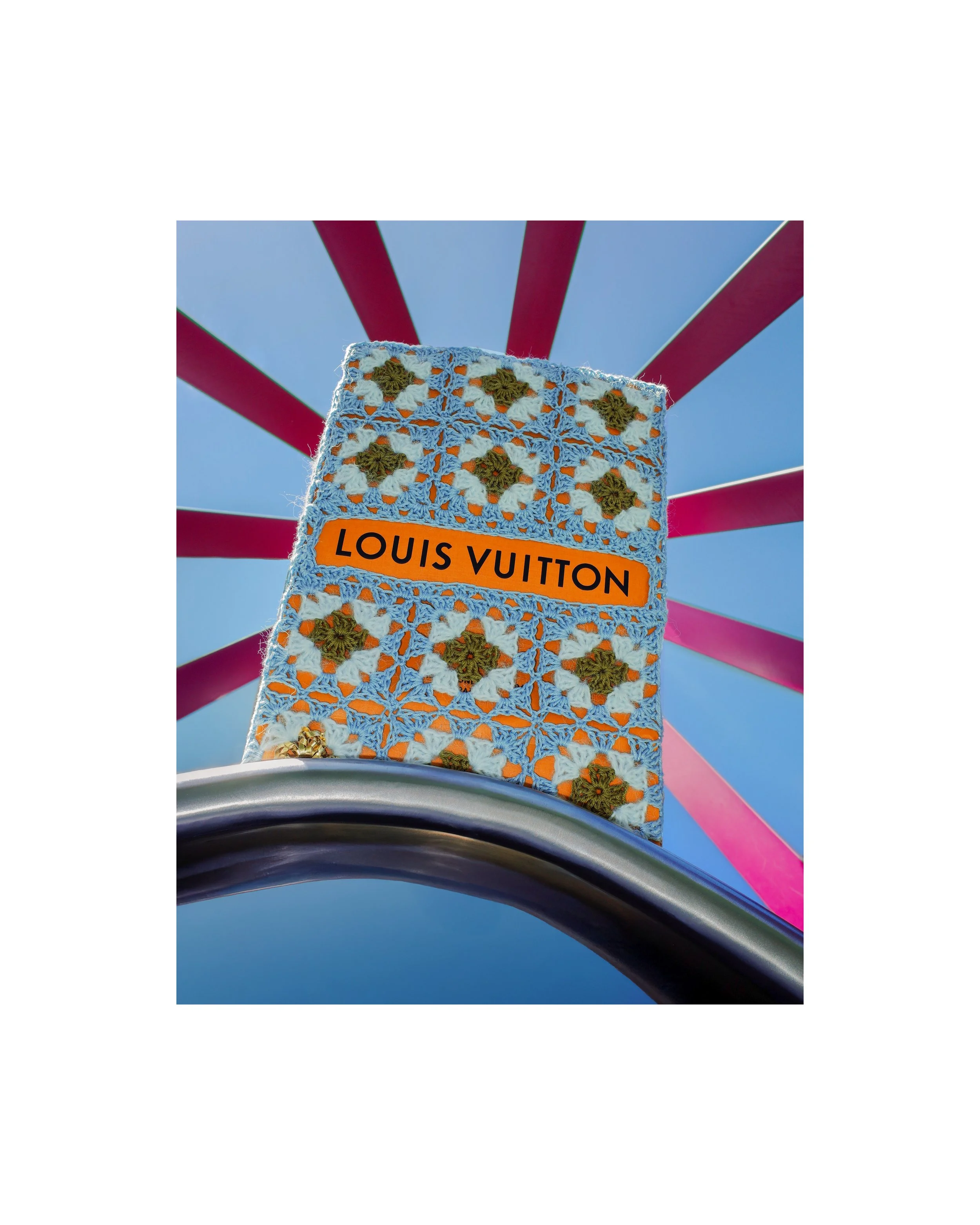 Louis Vuitton bag wrapped in light blue and gold hand-crocheted textile sculpture by Paris artist Sophie Inard