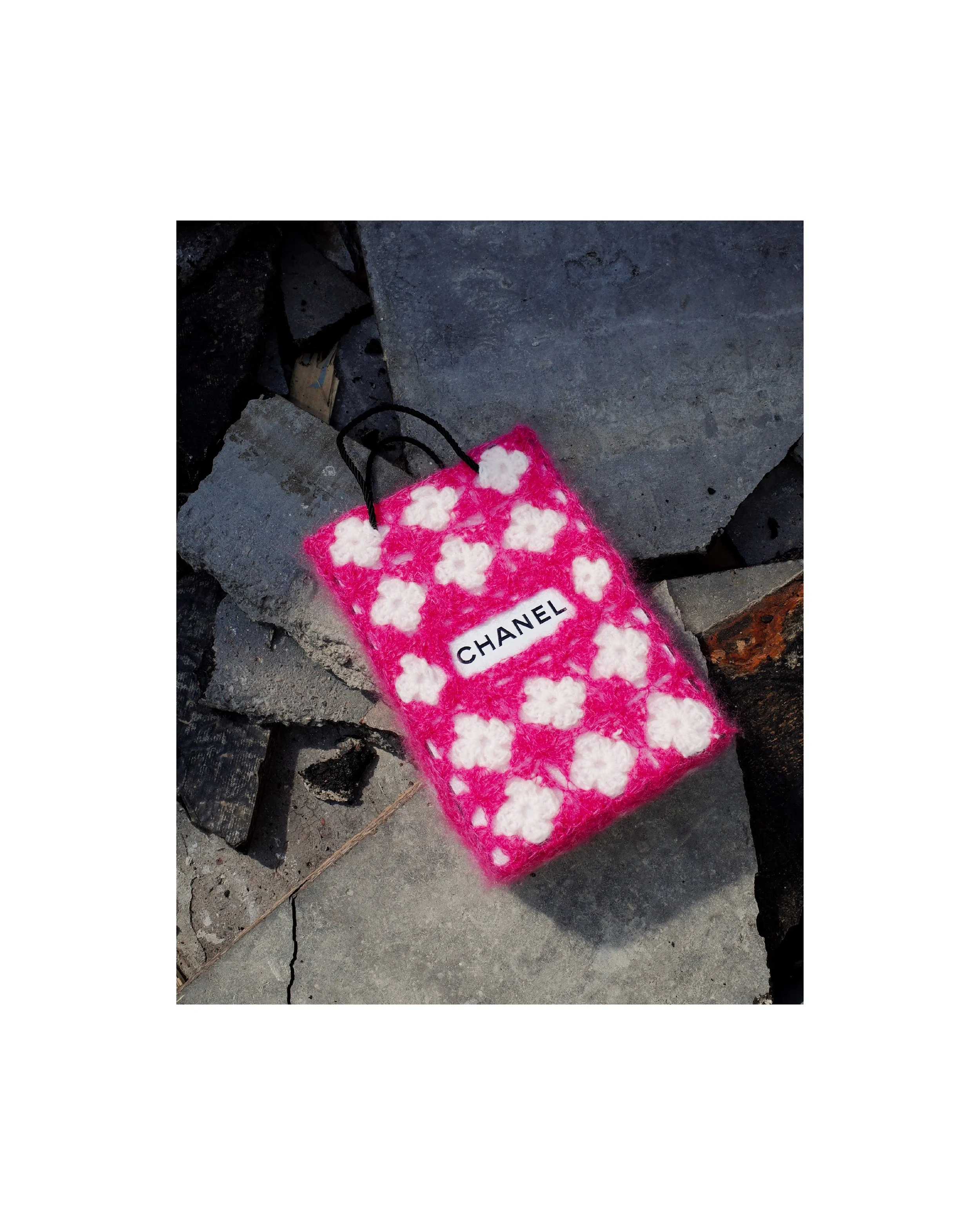 Chanel bag wrapped in pink hand-crocheted textile sculpture by Paris artist Sophie Inard