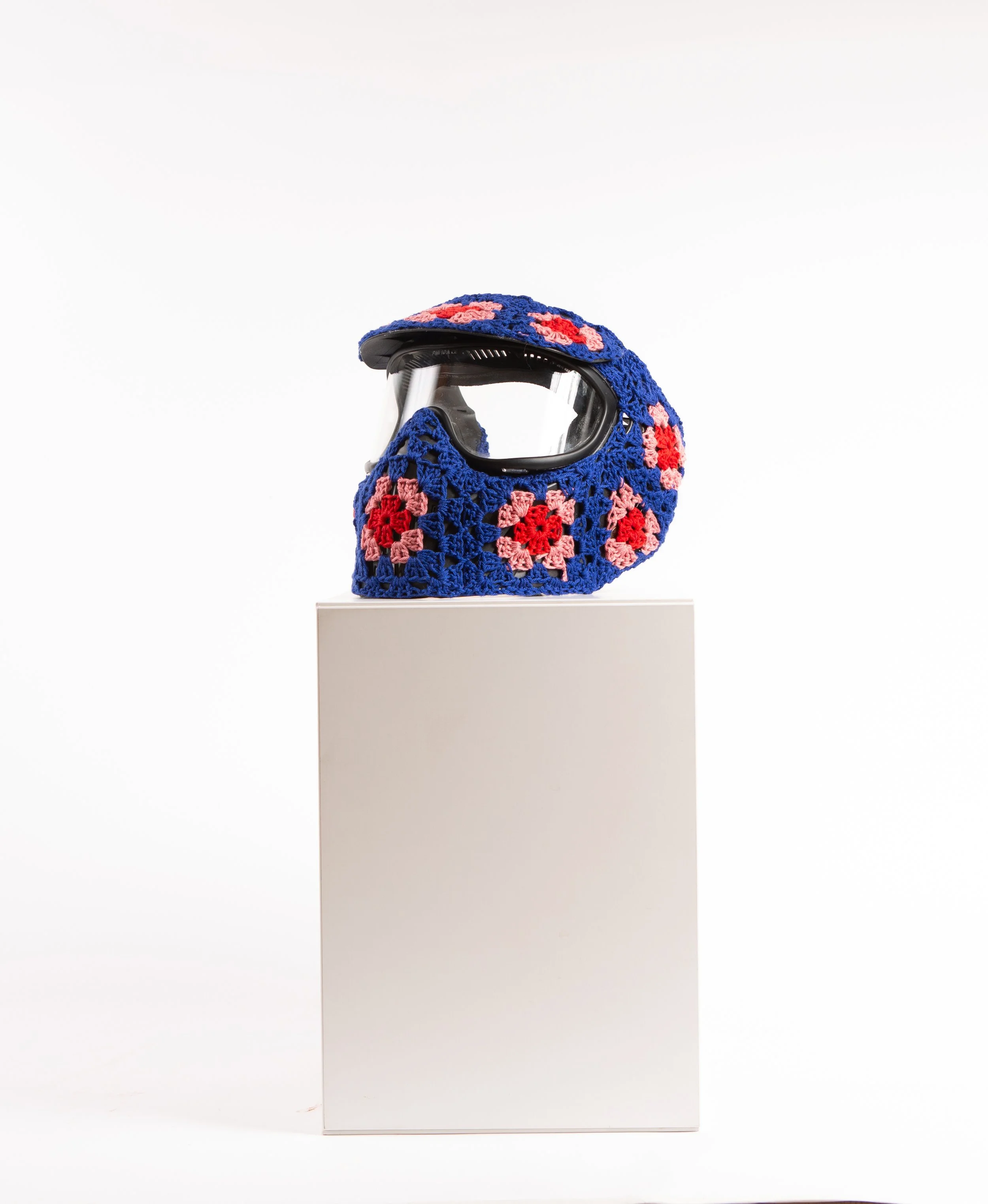 Blue helmet hand-crocheted textile sculpture close-up by Paris artist Sophie Inard