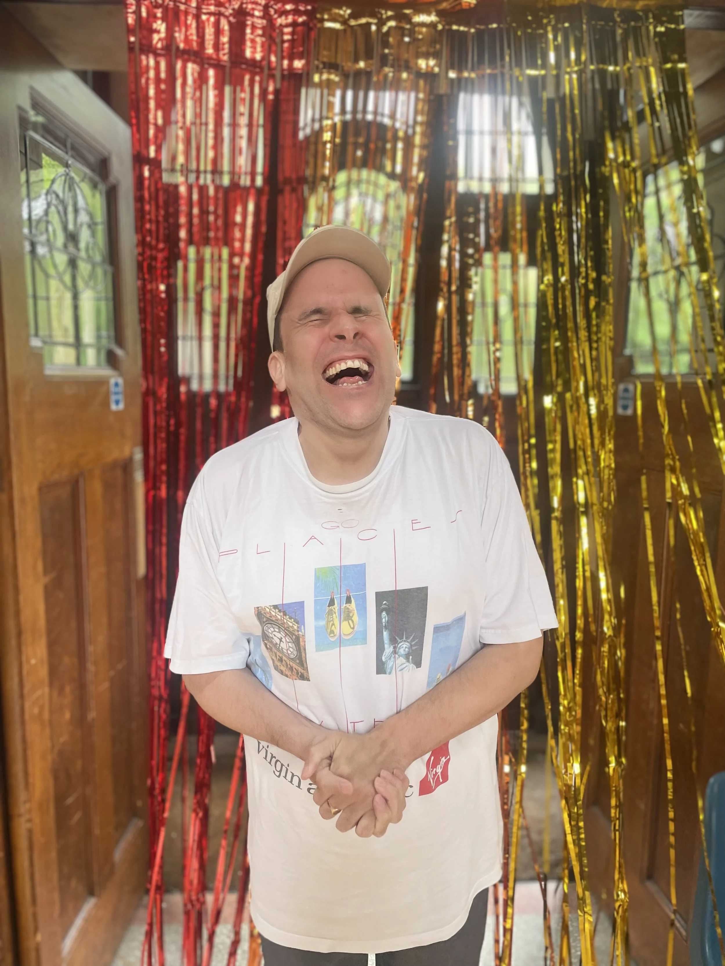 One of our Make a scene students smiling with his eyes closed.