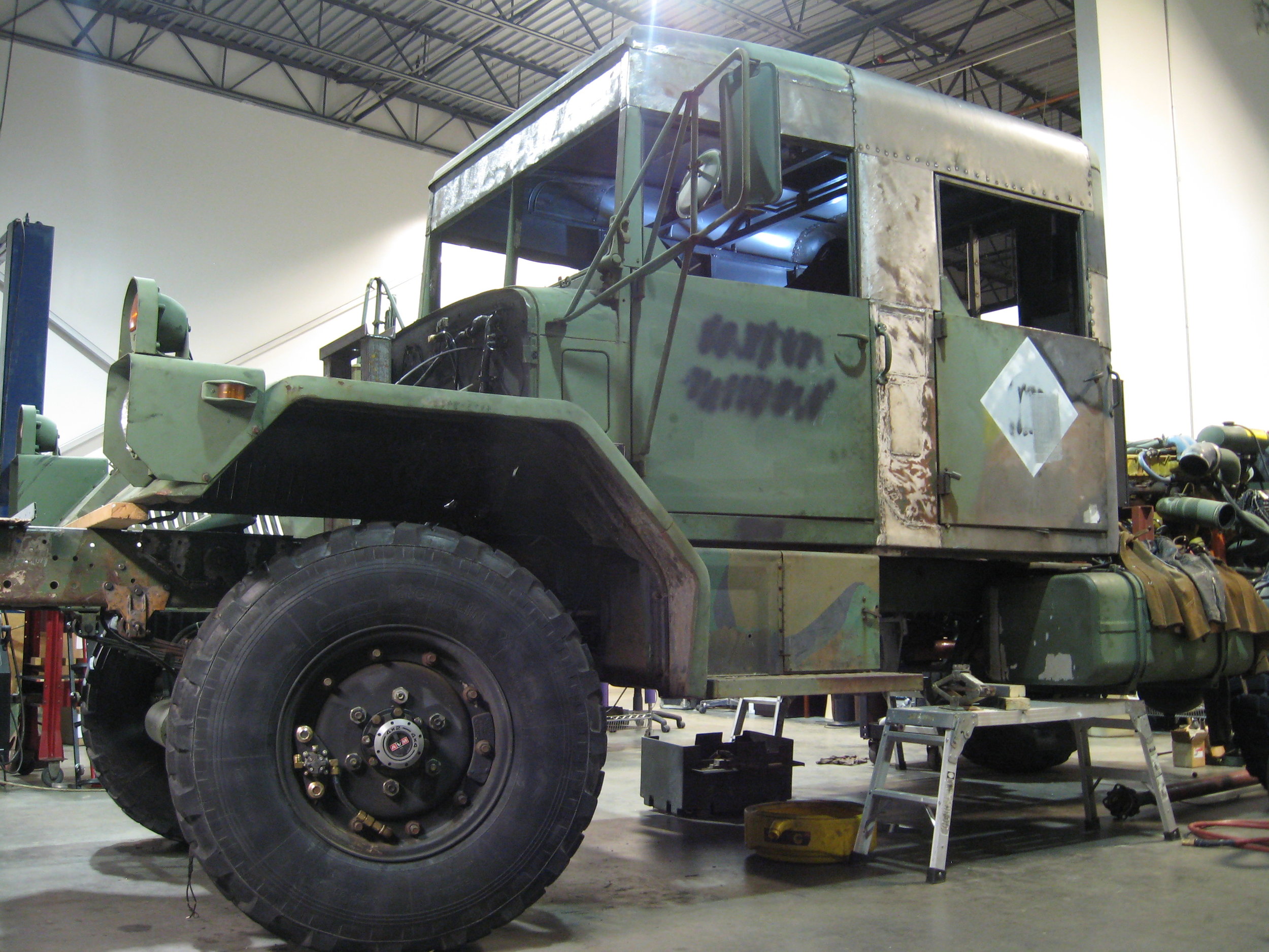  Two M35 cabs were sectioned and joined to fabricate a crew-cab with a raised hard roof. The cab was designed to accommodate a driver and two operators, and a contained computer compartment, which was cooled and pressurized by a roof mounted A/C unit