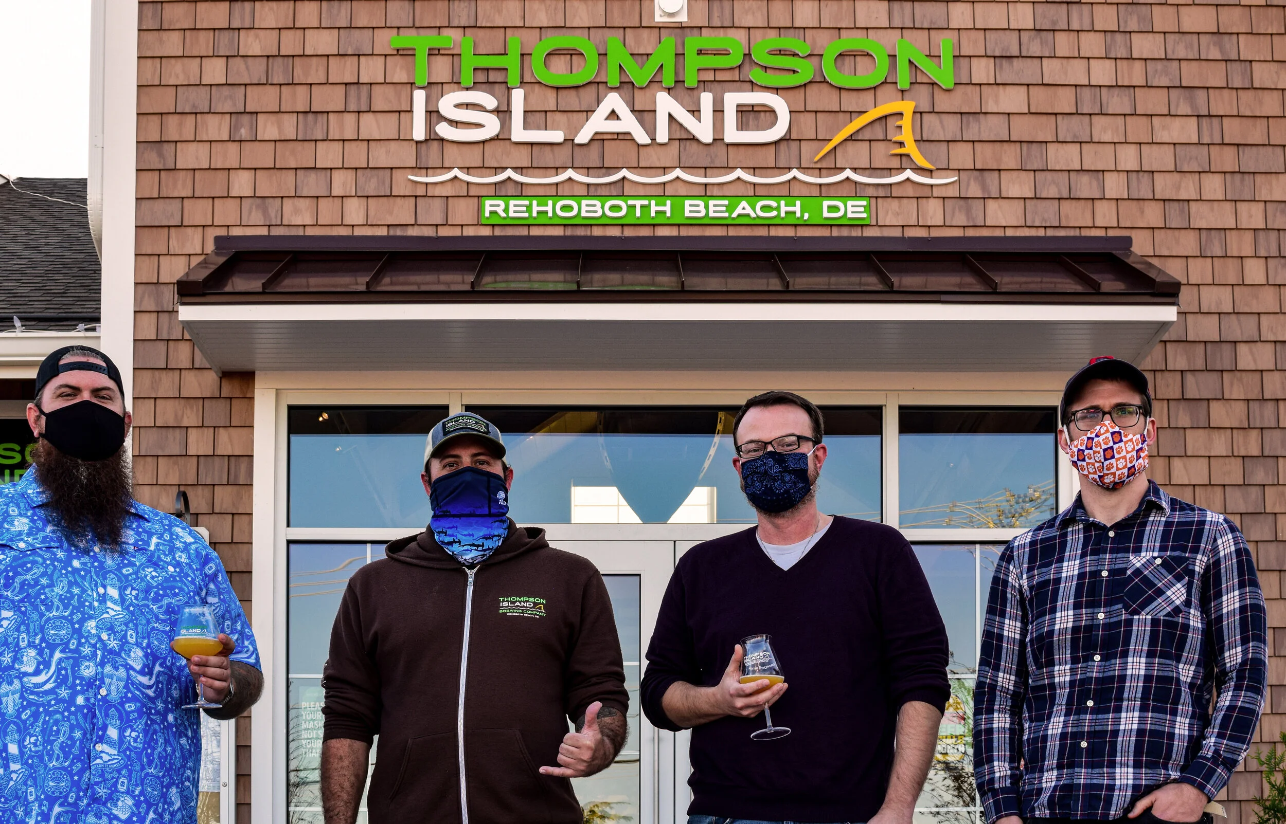 Homebrewing contest: from left, Sean Phipps, second-place winner; Jimmy Valm, brewmaster; Nathan Follmer, first-place winner; and Clayton Ruminski, third-place winner.