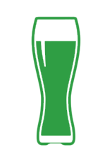 A glass filled with green liquid