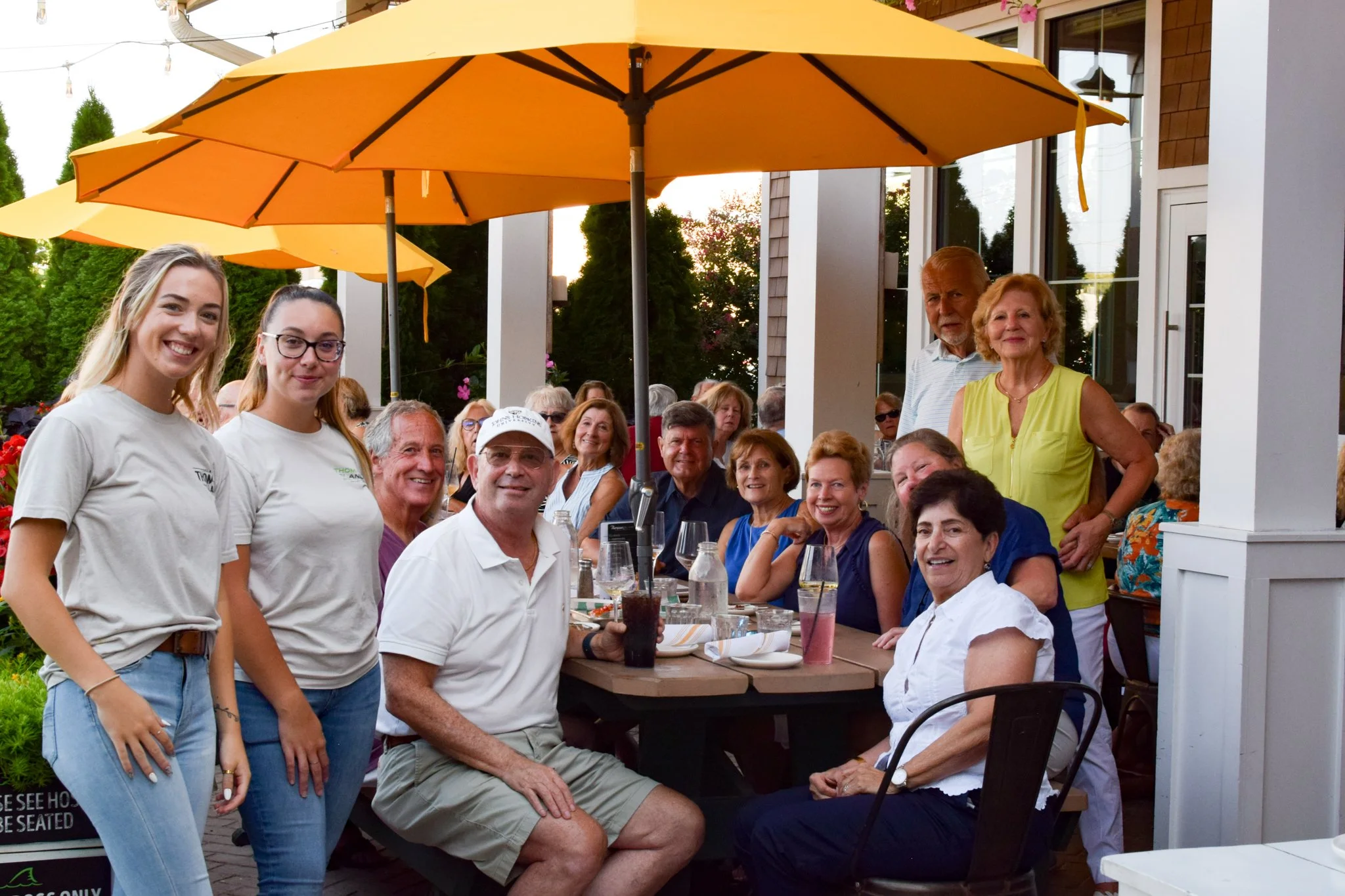 Group of guests enjoying outdoor dining at Thompson Island Brewing in Rehoboth Beach