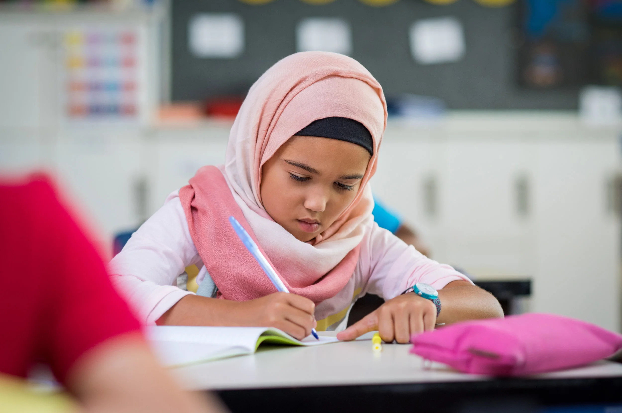 young-girl-wearing-hijab-studying-PZ9S7WR.jpg