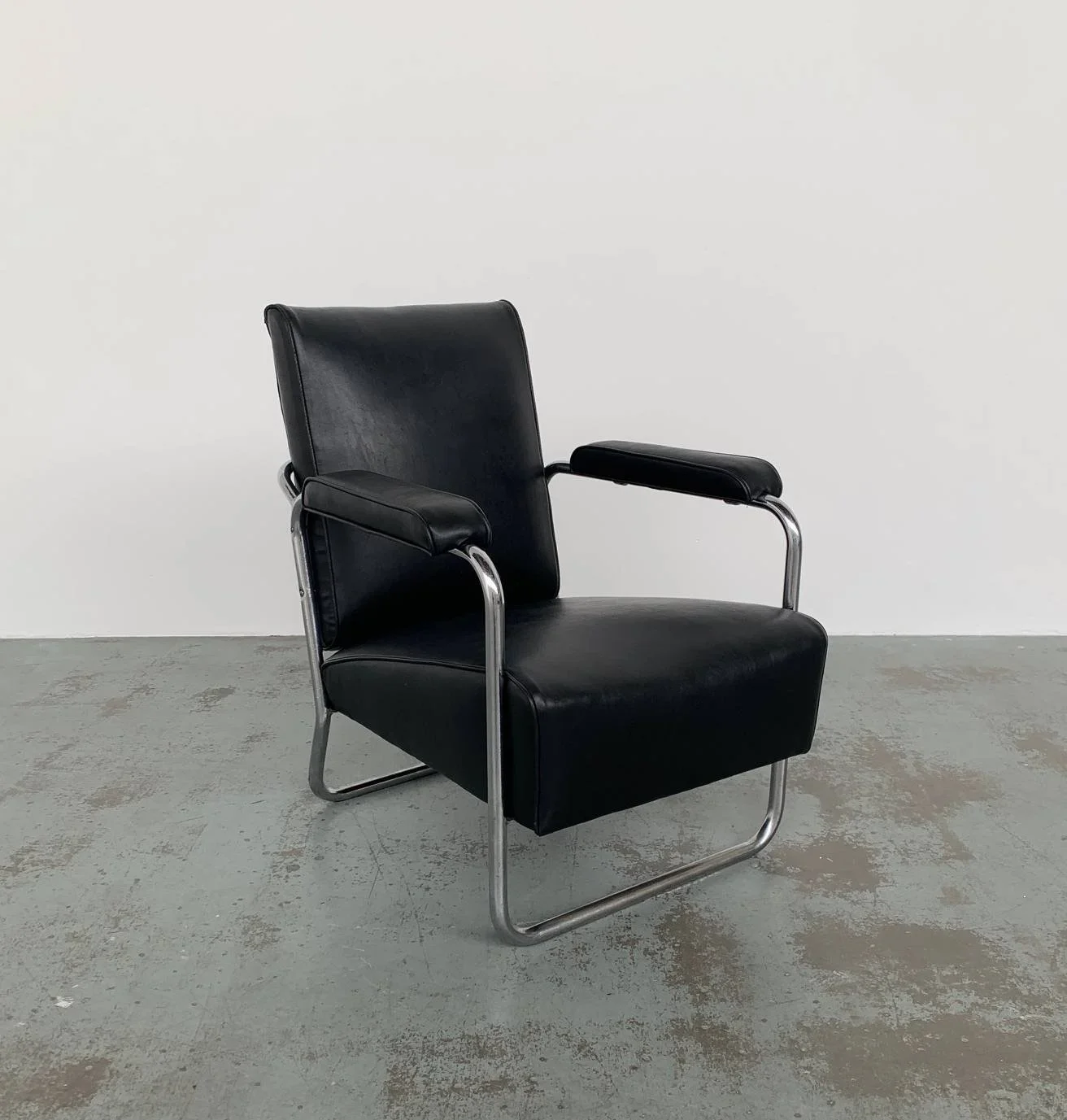 1930’s+black+vinyl+PEL+Chair.webp