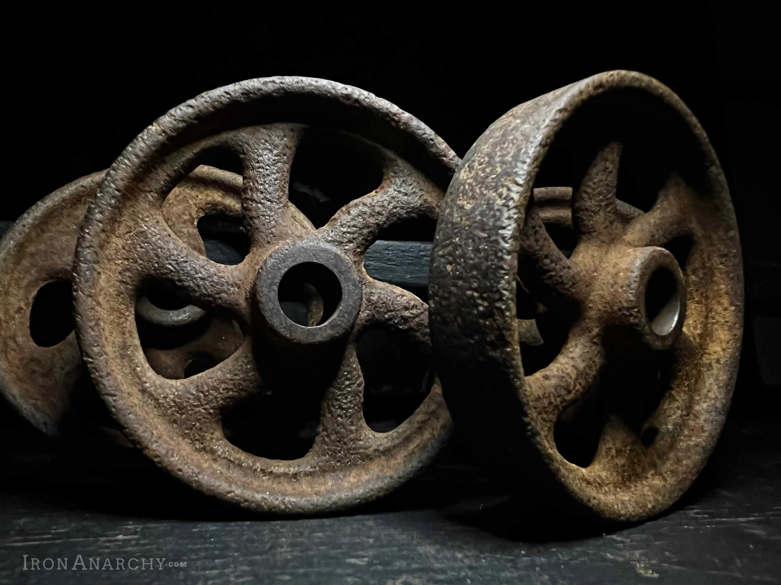 Set of antique industrial factory cart wheels. Vintage cast iron caster