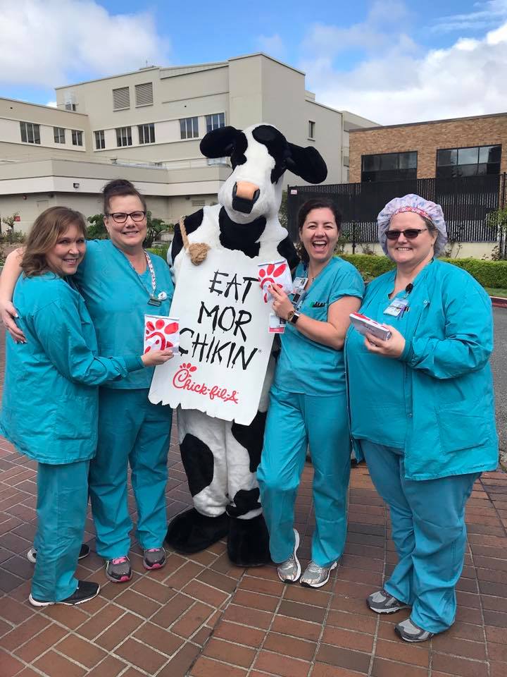 Four female nurses with Chick-fil-A cow