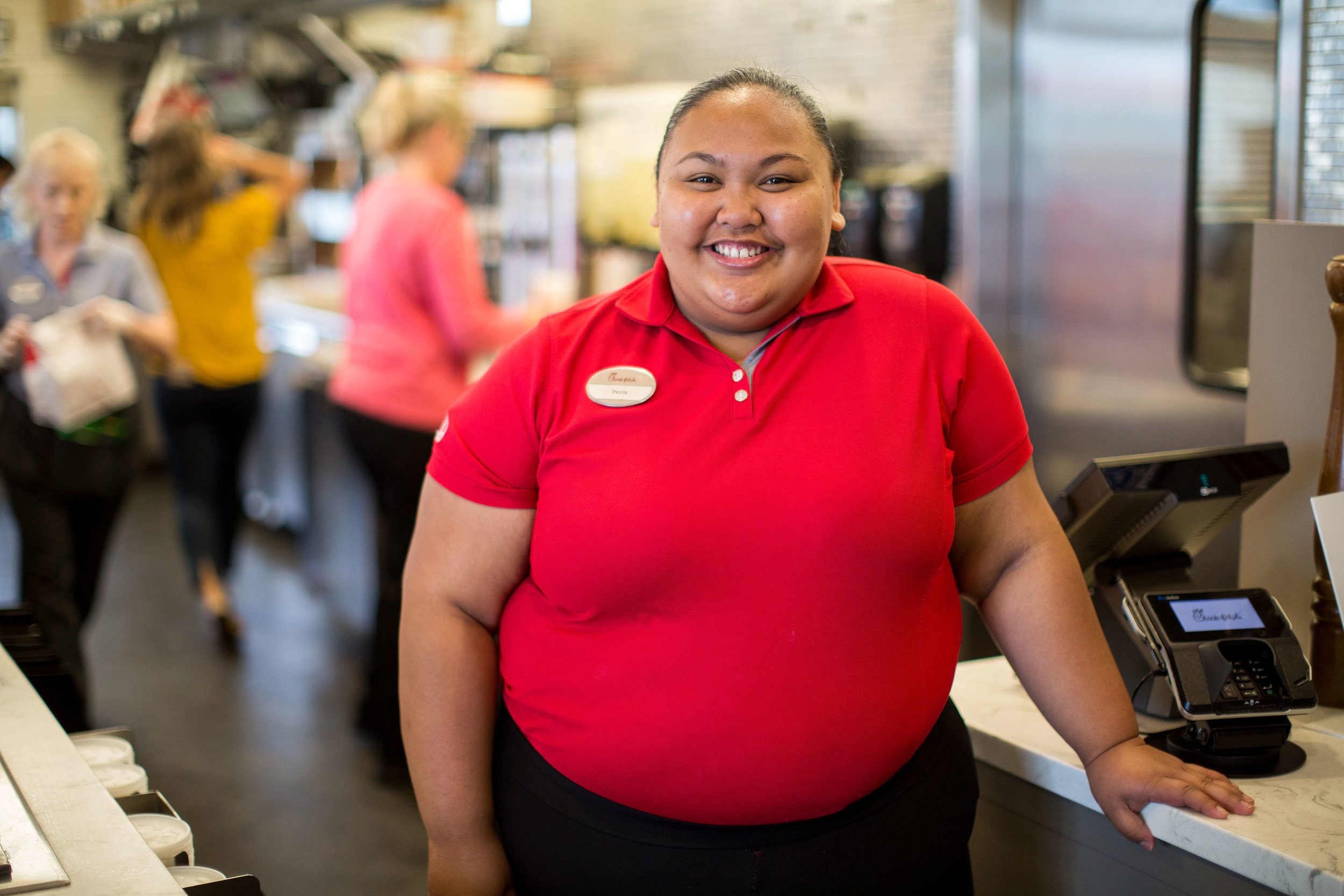 Female front of house team member smiling