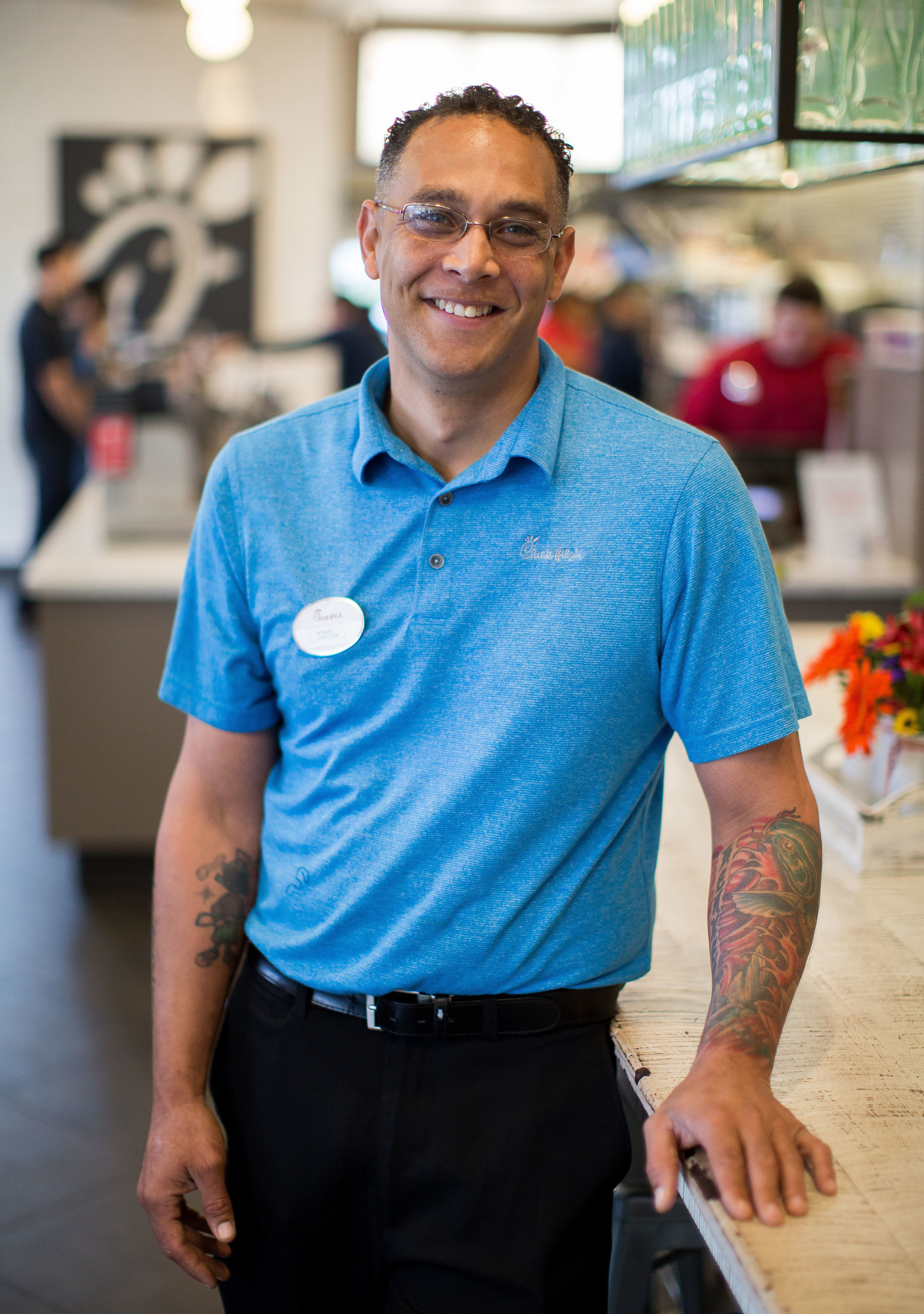 Male front of house team member smiling