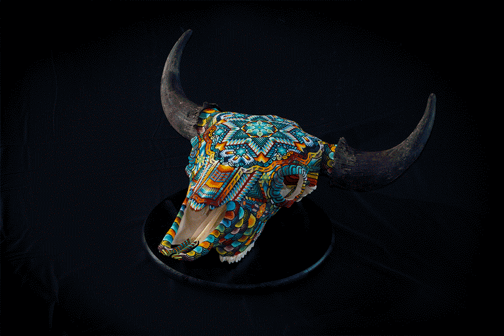 This is one of the most complicated pieces I have ever made. The design uses over 45 different bead colors. There is a blend of geometric and organic pattern moments all over the skull.