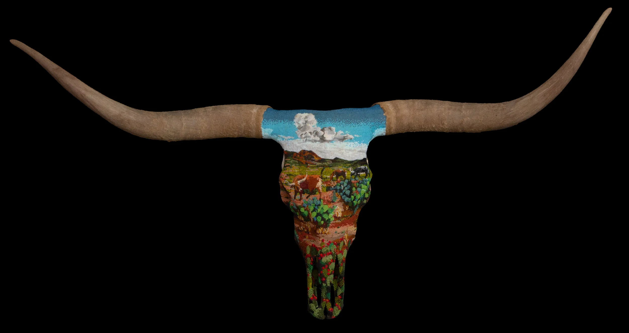  Big Bend Chisos mountains landscape with three grazing longhorns. Prickly pear cactus in the foreground around the snout. all under an 11-color sky with  a rolling cumulus cloud. I used over 60 different colors of beads. This was the first time I’ve