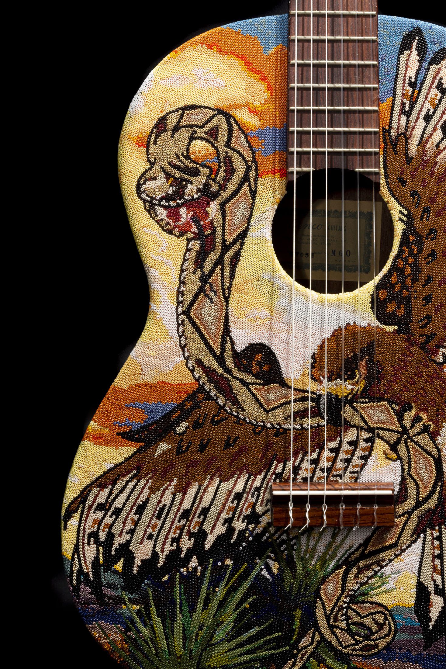  This is the second piece of a trio of guitars with a ‘bird-conflict’ theme. On each guitar there is a common Texas bird- Pheasant, Red Tailed Hawk, and Roadrunner. Each guitar depicts an interaction between 2 animals- the bird and its predator or it