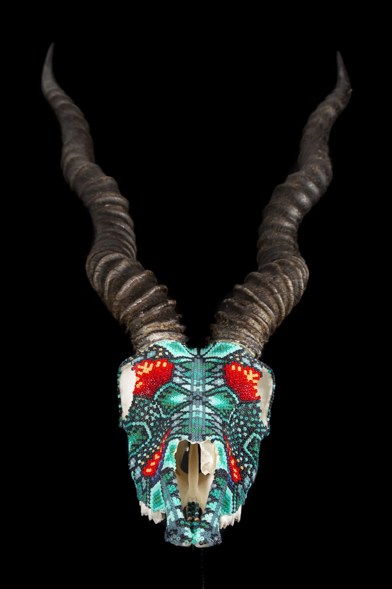  This was the second piece of a two-skull-commission. This is another “freestyle” improvisational design that used 13 different seed bead colors 