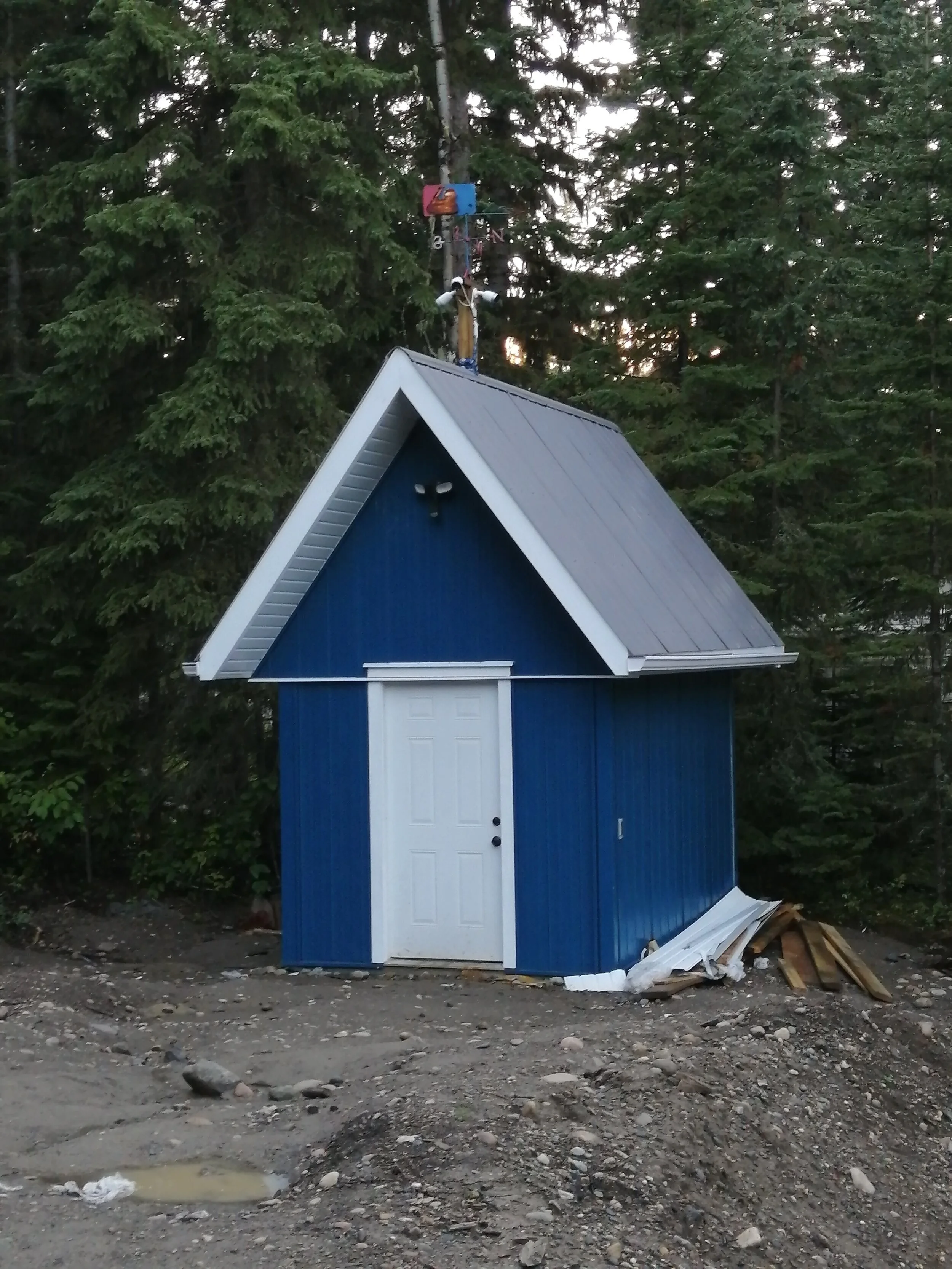Power shed with metal siding