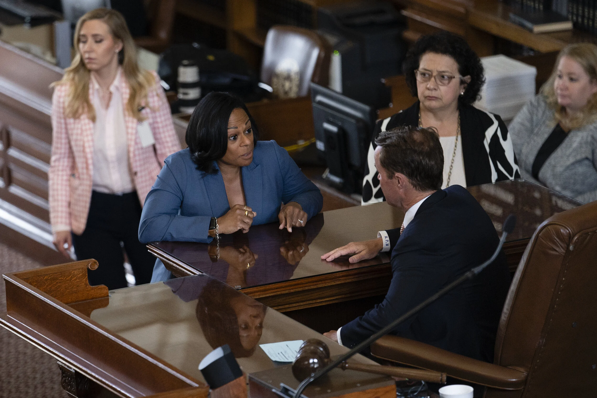  Texas State Rep. Nicole Collier, speaks with House Speaker Dade Phelan on opening day of the 87th Legislative Special Session at the Texas Capitol on July 8, 2021. 