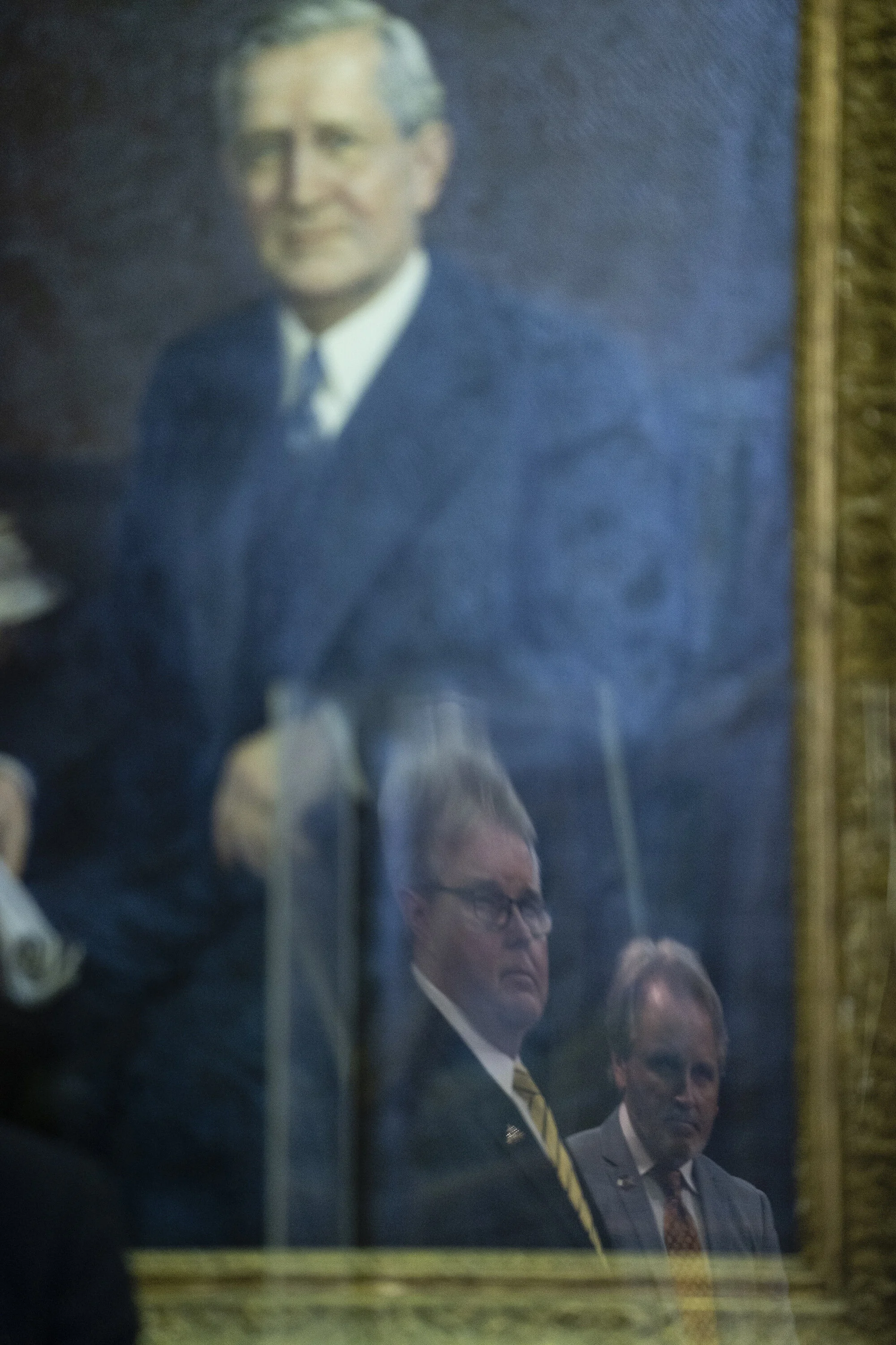  Texas Lt. Gov. Dan Patrick and Rep. Bryan Hughes, are reflected in plexiglass at a press conference held regarding Democrats breaking quorum and voting legislature at the Texas Capitol on July 21, 2021. 