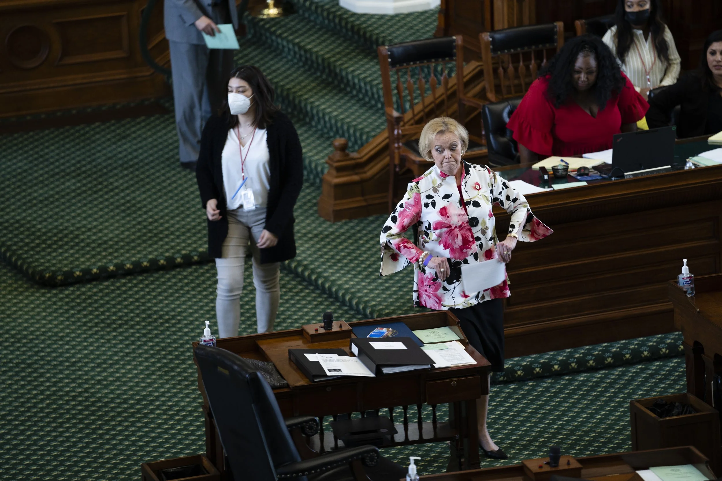  Texas State Rep. Beverly Powell walks back to her desk after opening the Senate in prayer on Aug. 10, 2021. 