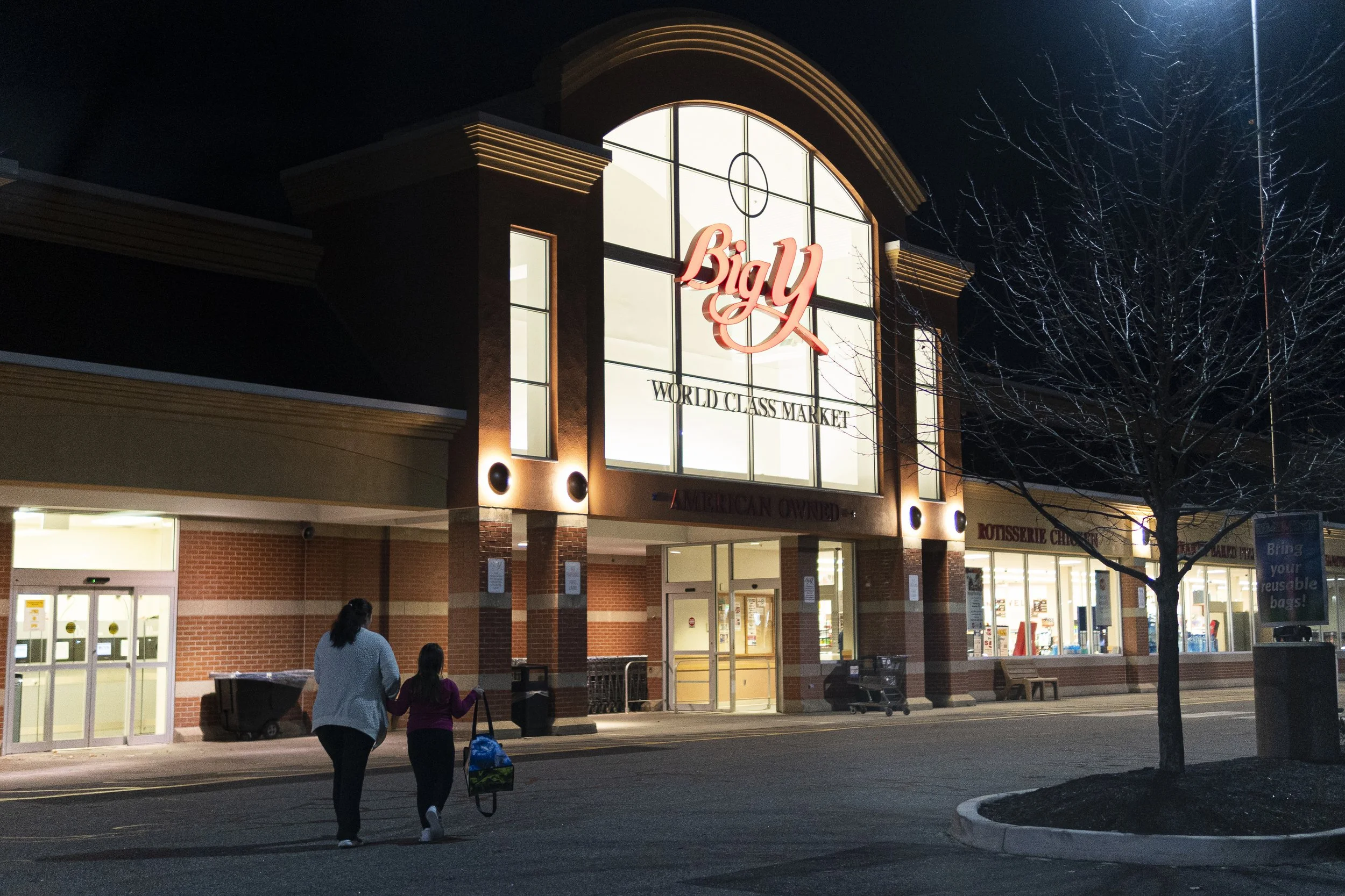 Shellie walks with Bella towards the Big Y in Torrington, CT, where Shellie must hand off Bella to her father.