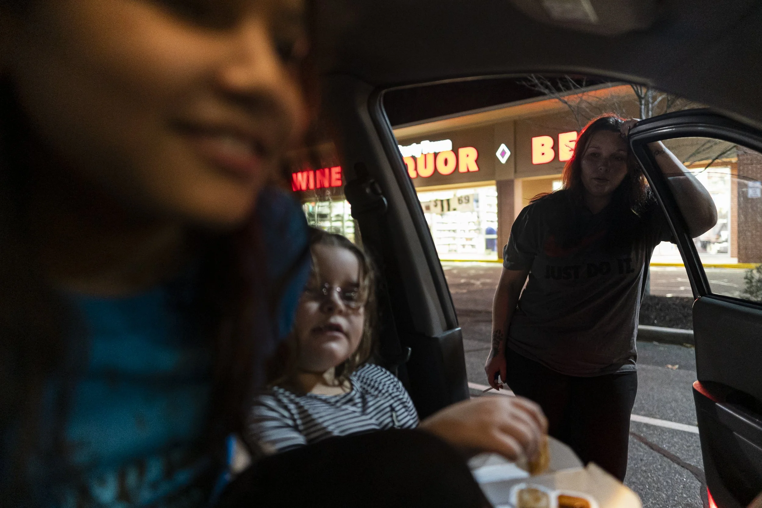 Emma Velez, and Bella Marinelli, 8, eat their McDonalds dinner while Shellie prepares to drop her daughter Bella off with her ex-husband at the Big Y in Torrington, CT. Amidst a custody battle, Shellie only sees Bella three times a week, for a few ho