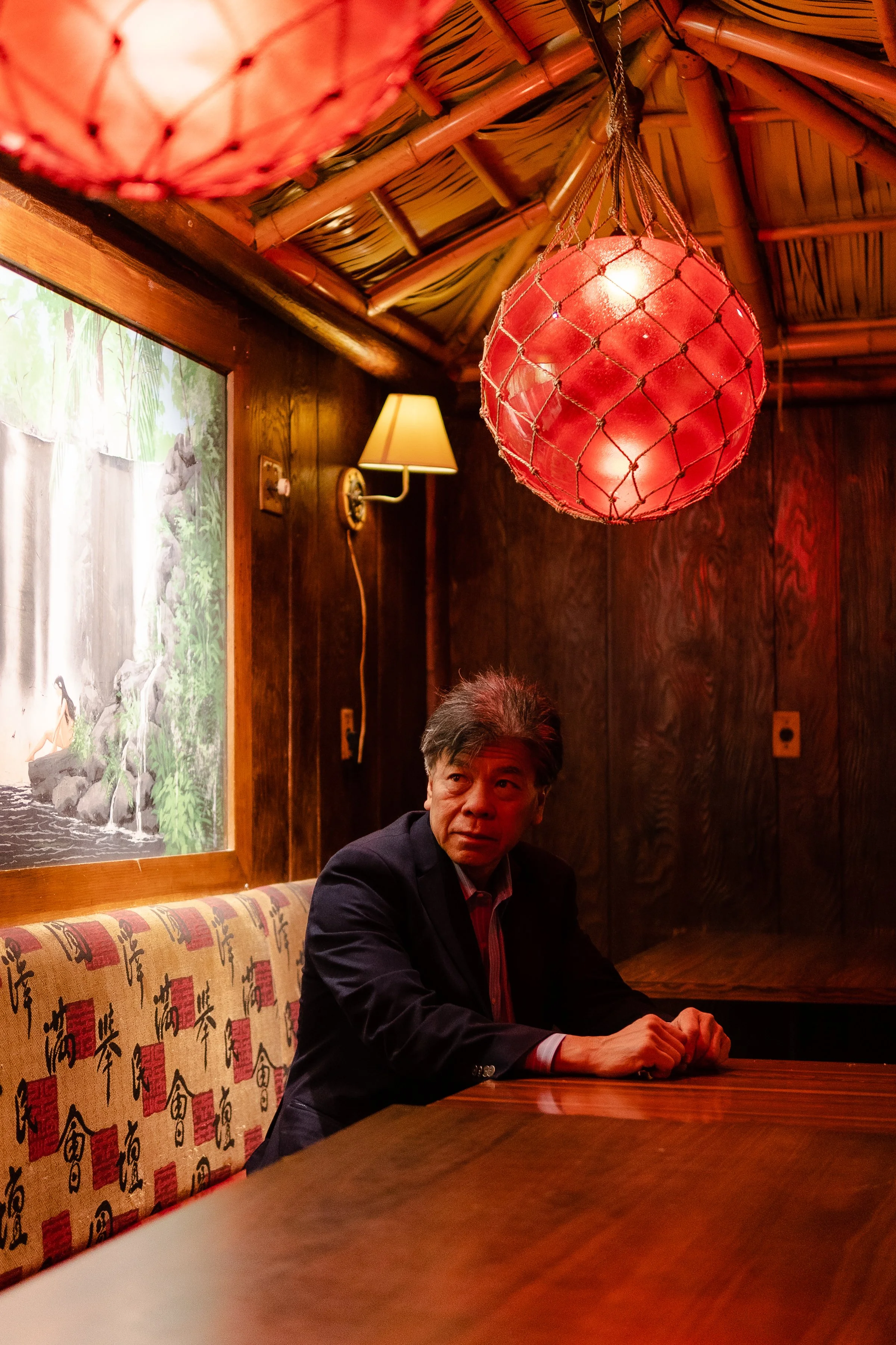  Bob Wong, who owns Kowloon restaurant with his family, sits for a portrait in the dining room of the restaurant in Saugus, MA on March 8, 2022. The Wongs have owned the restaurant for 72 years. 