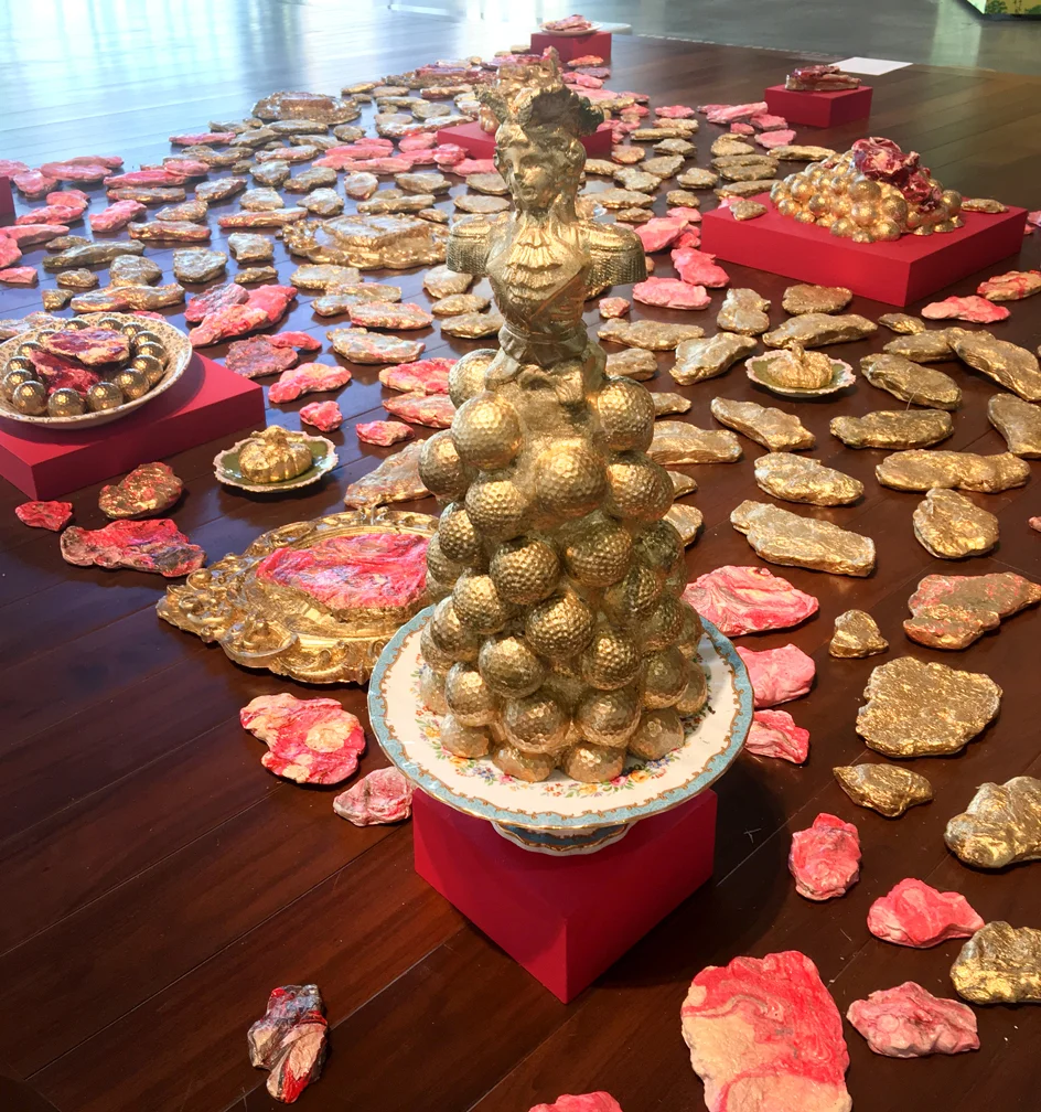 Let them Eat Steak (49% of the World’s carbon emissions are produced by 4% of the population), 2018. Cast Plaster of Paris, gold leaf, acrylic and oil paint Varied size, multi object installation