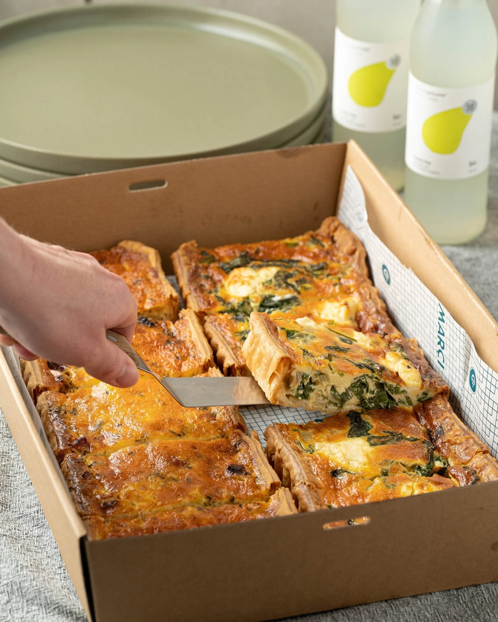 A tray of house-made quiche served at a Marché-catered event in Melbourne