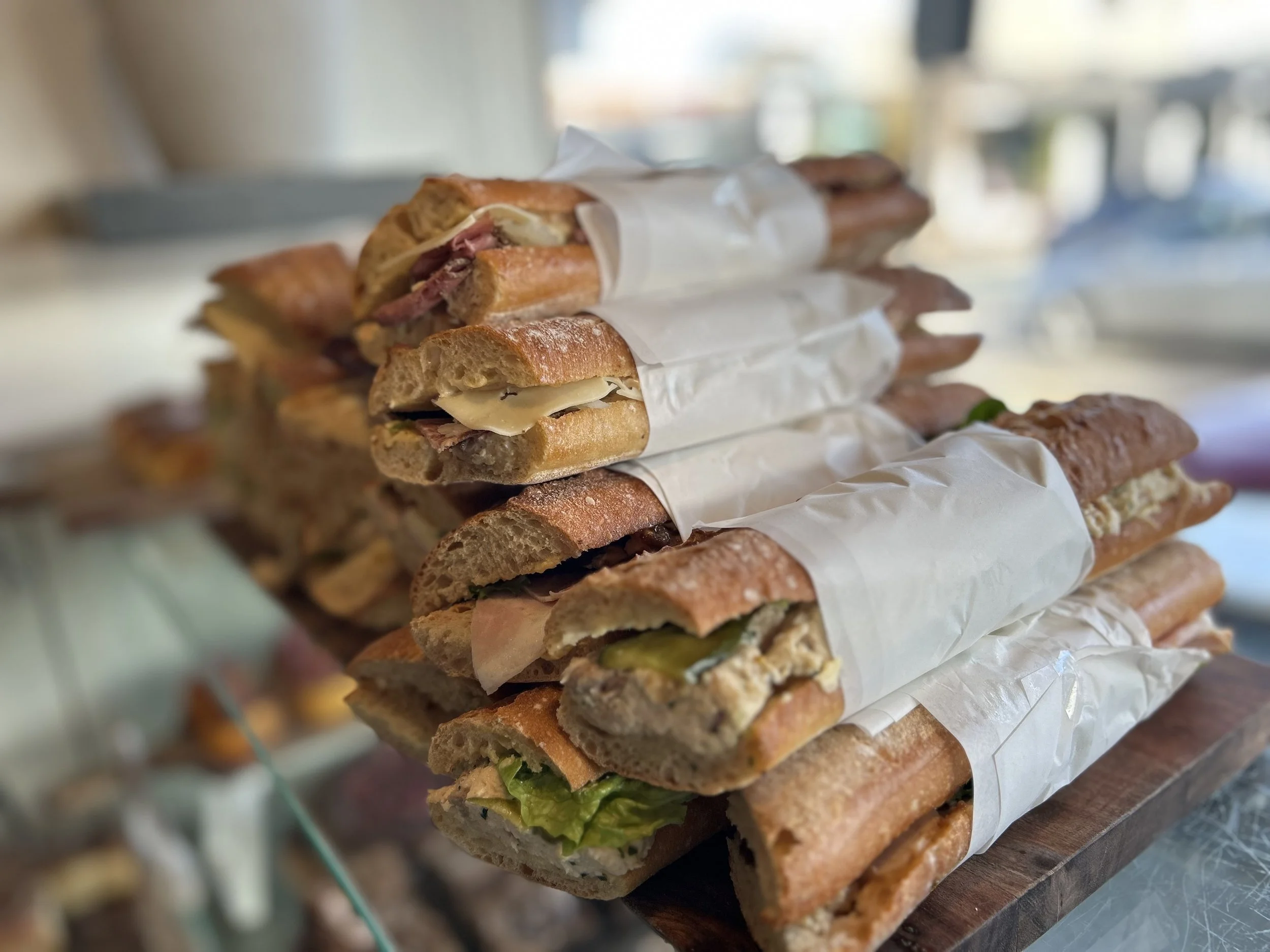 Fresh sourdough baguettes on display.