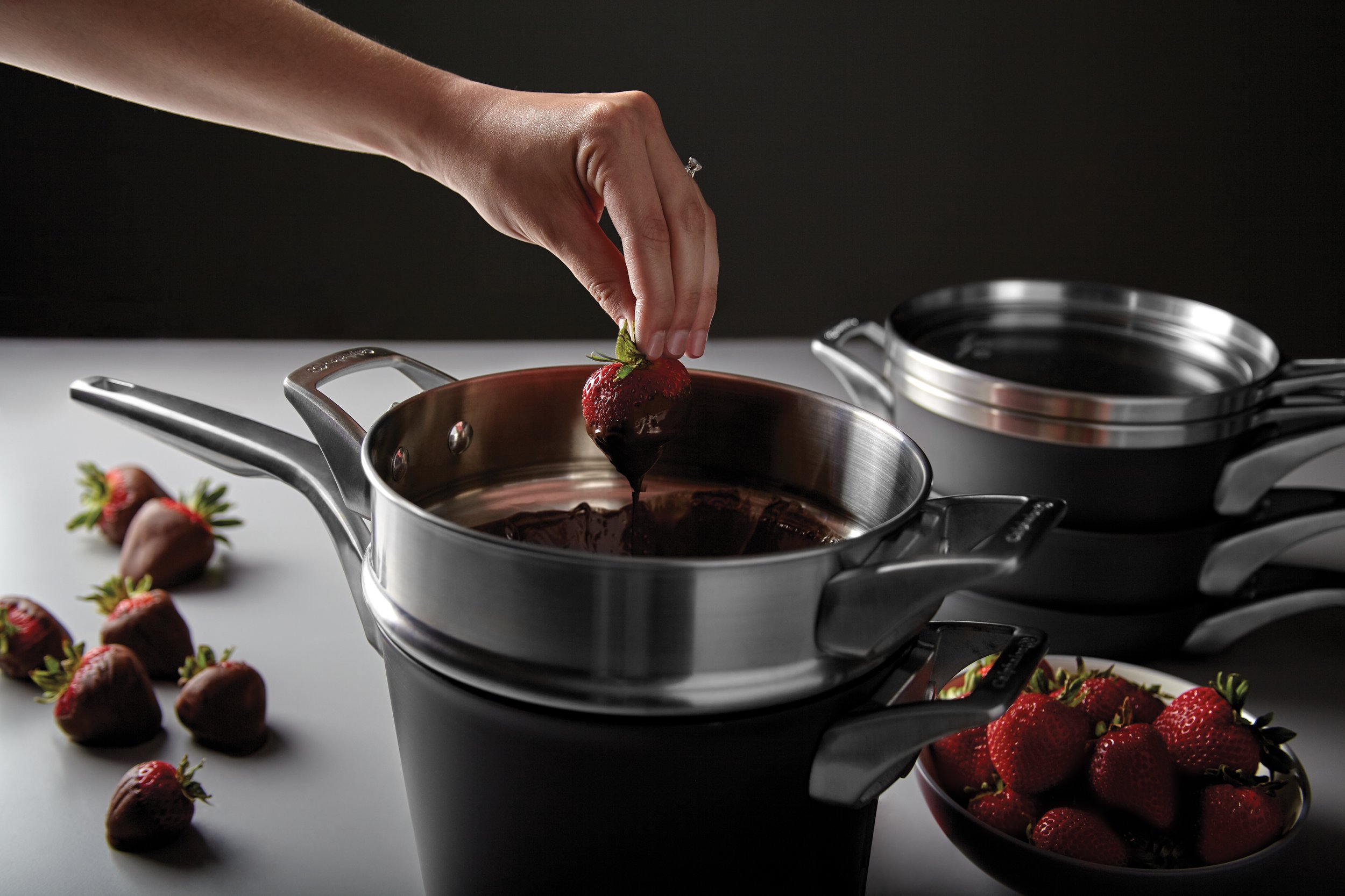 calphalon-premier-space-saving-non-stick-hard-anodized-bridal-in-use 1.jpg