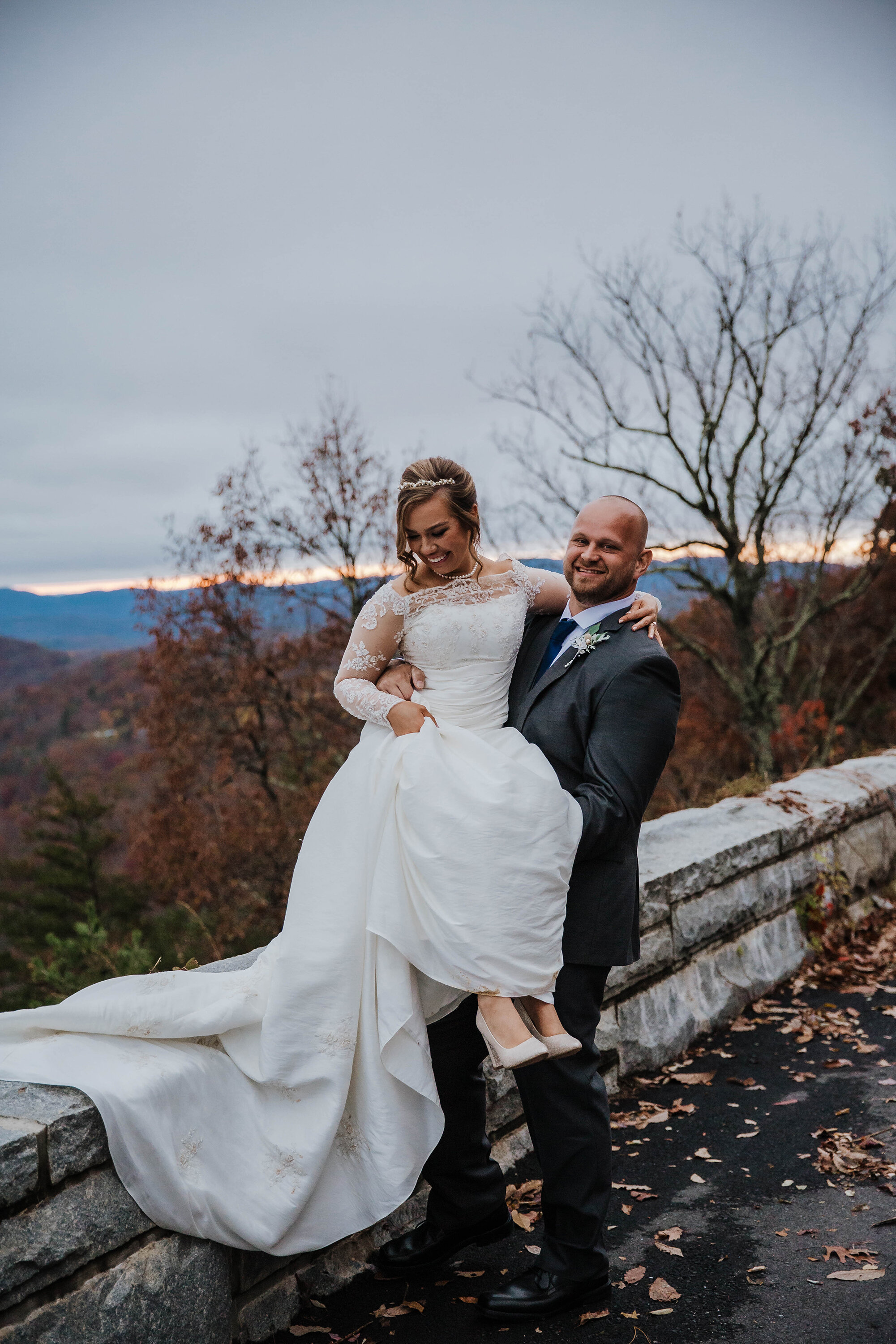 Foothills-parkway-groom-helping-bride-elopement.jpg